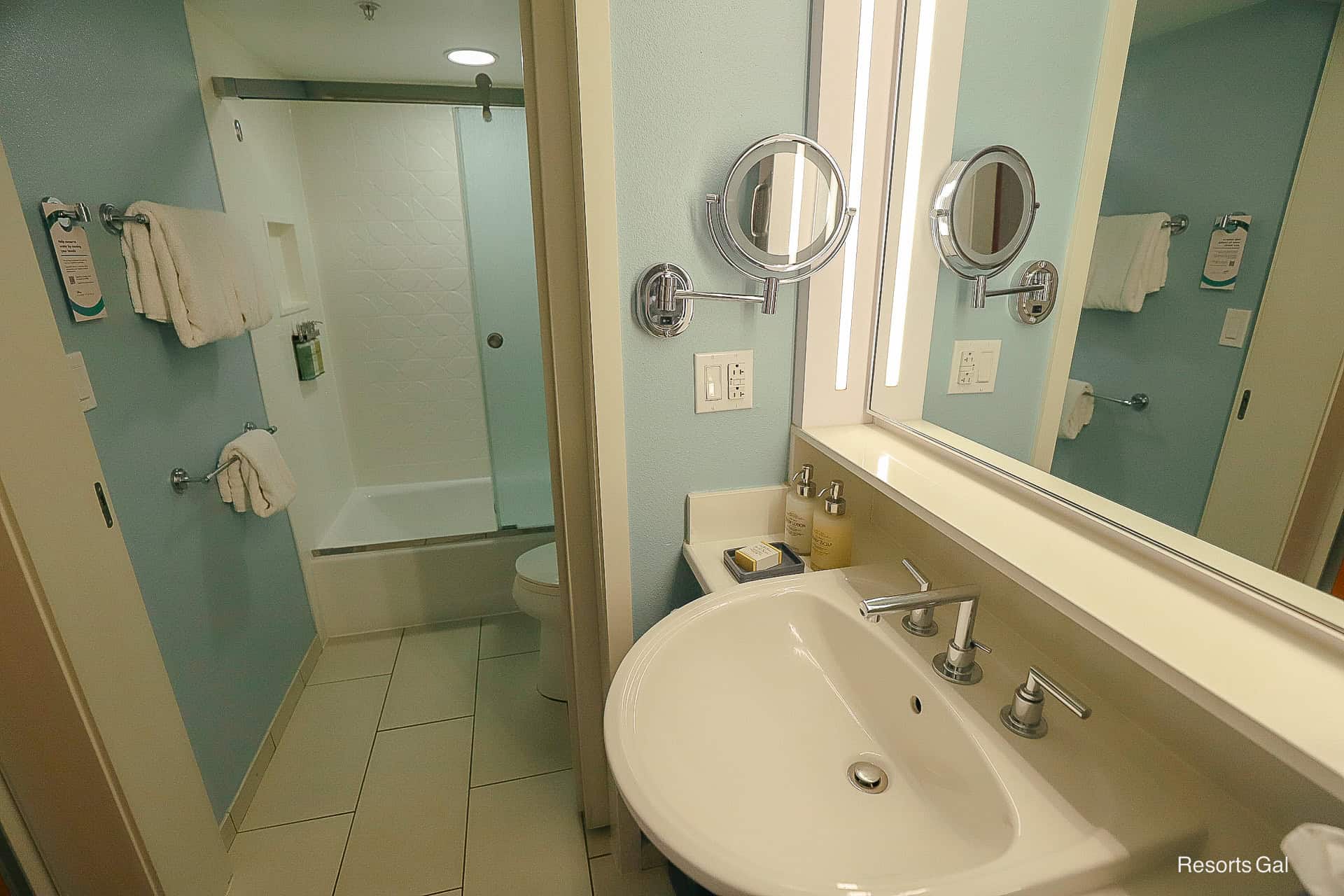 a pocket doors separates the water closet from the vanity area in the room at Disney's Pop Century 