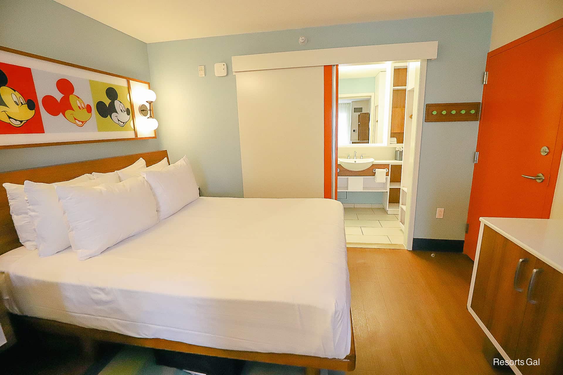 the pocket sliding door between the bath area with vanity and the main room at Pop Century