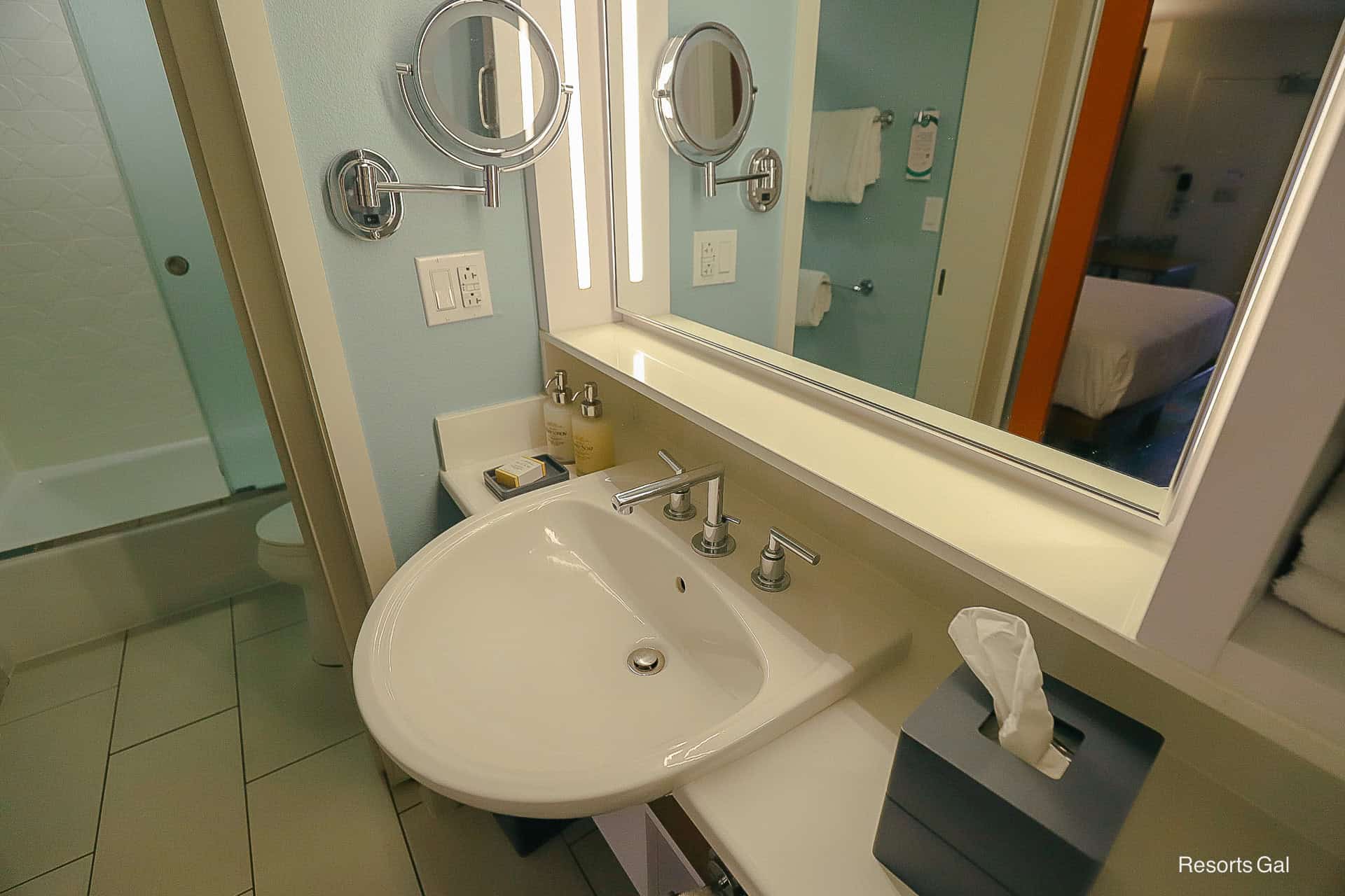 one sink, ledge, and makeup mirror in bath at Pop Century 