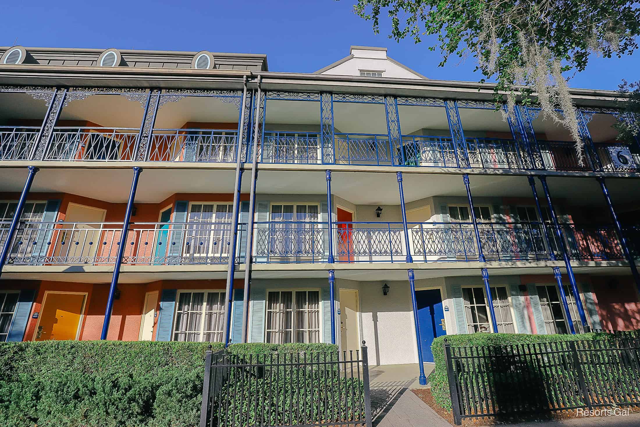 a building at Port Orleans French Quarter with deep blue railings 