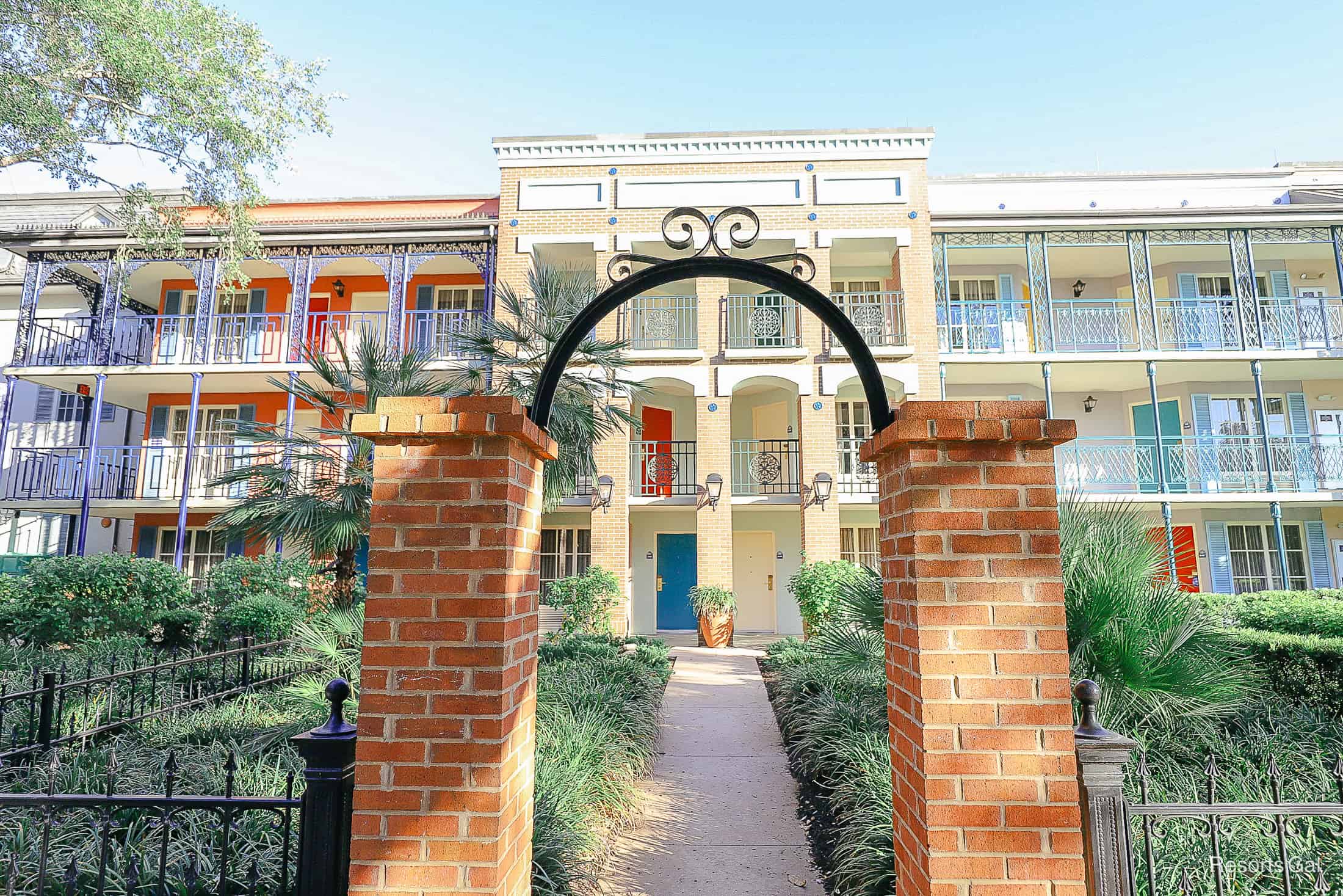 a brick entrance with black iron to a section of the resort at French Quarter 