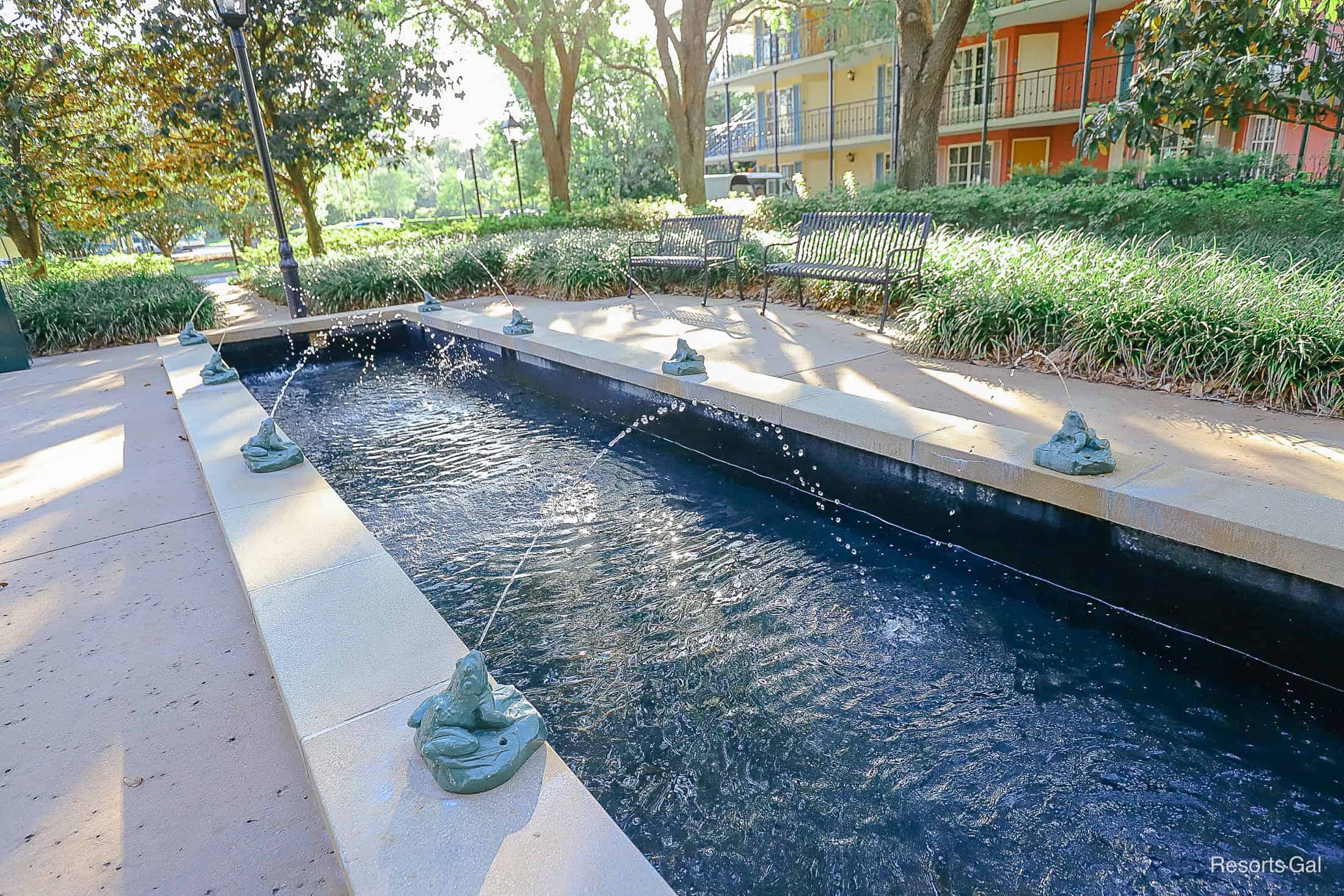 a long rectangular fountain with frogs at Port Orleans French Quarter 