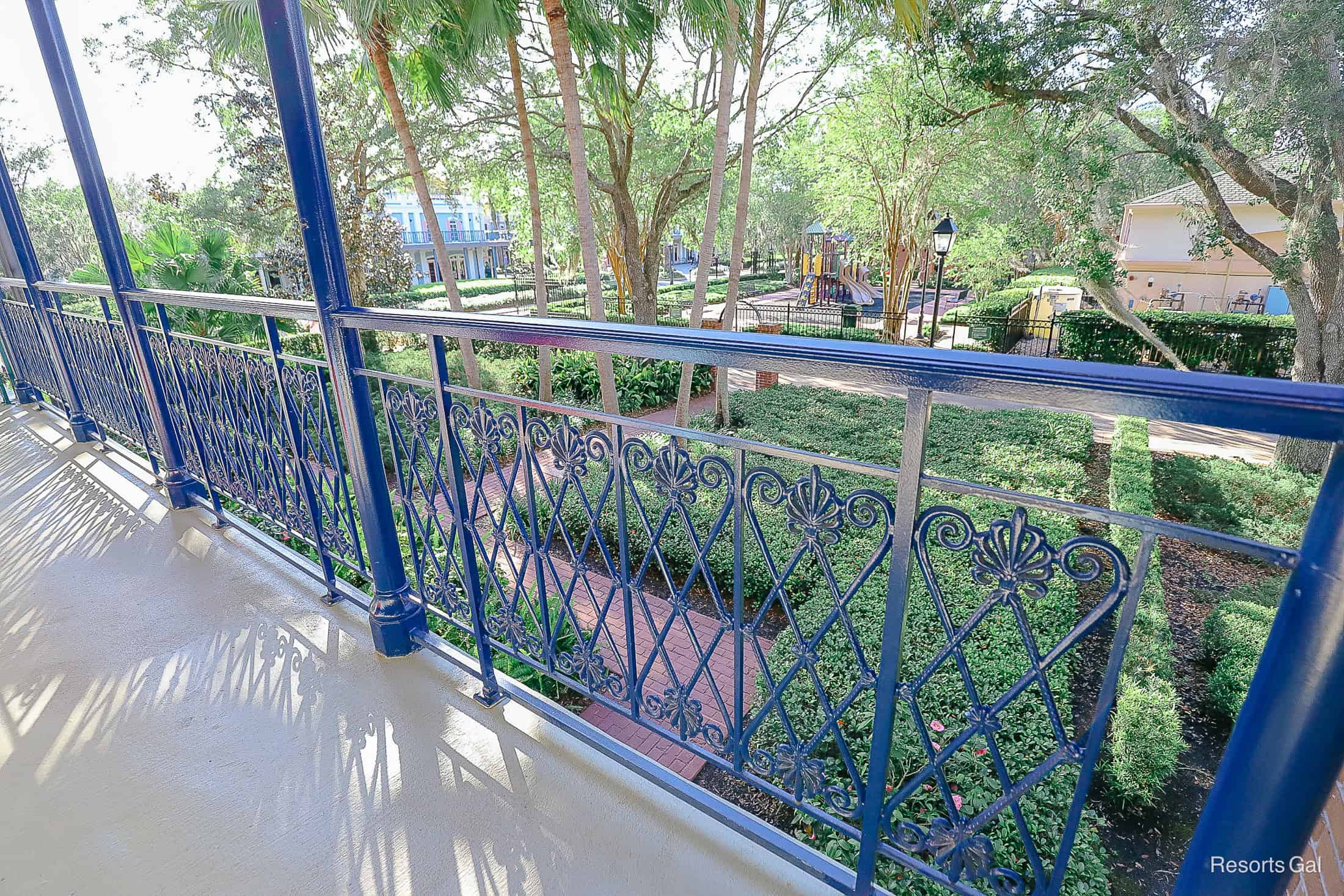 blue railings looking down to the courtyard 