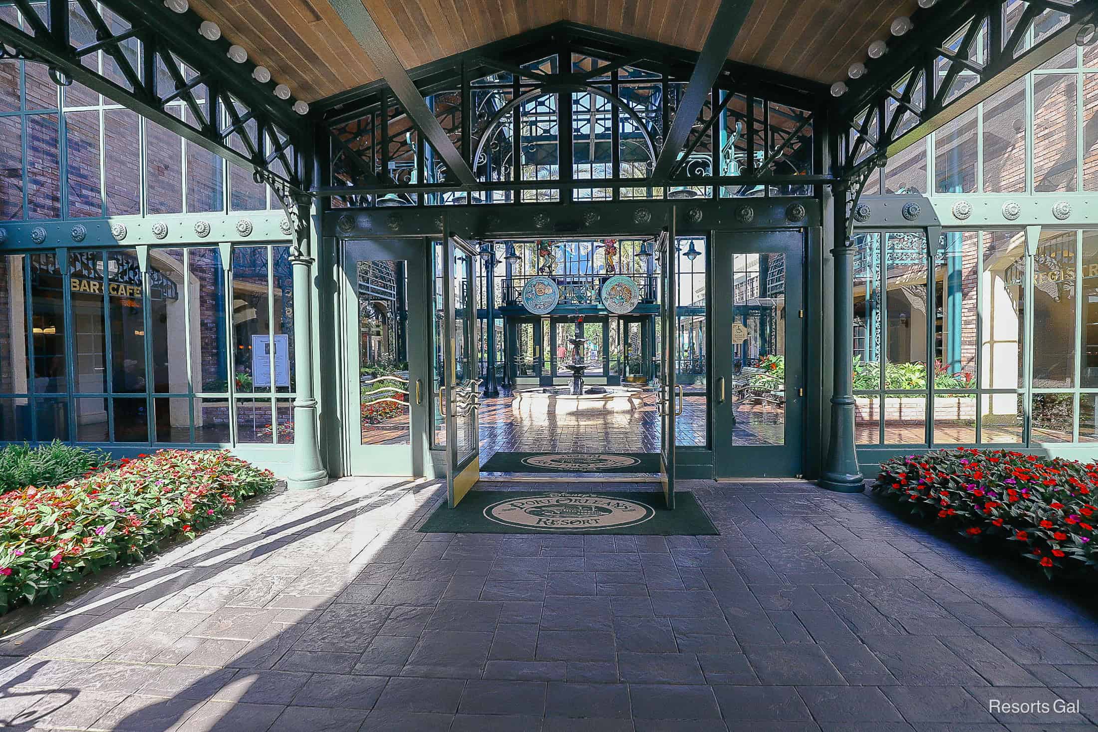 the glass door entrance to the lobby with the doors swung open 