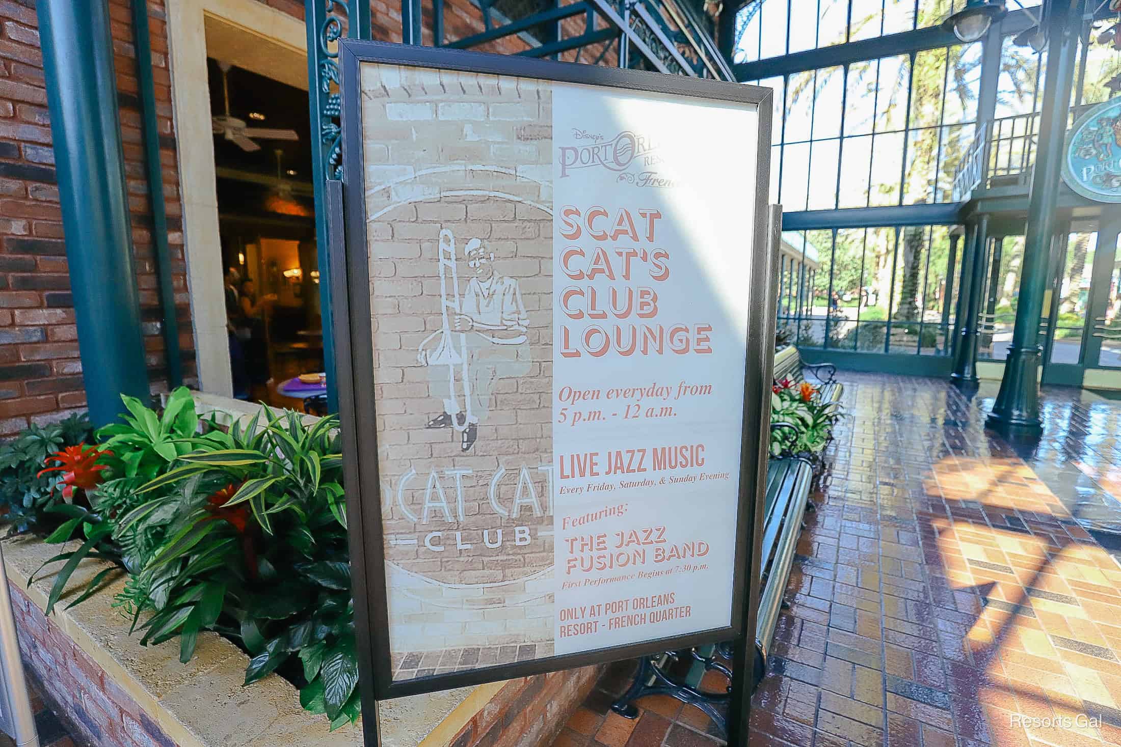 a sign advertising Scat Cat's Club Lounge