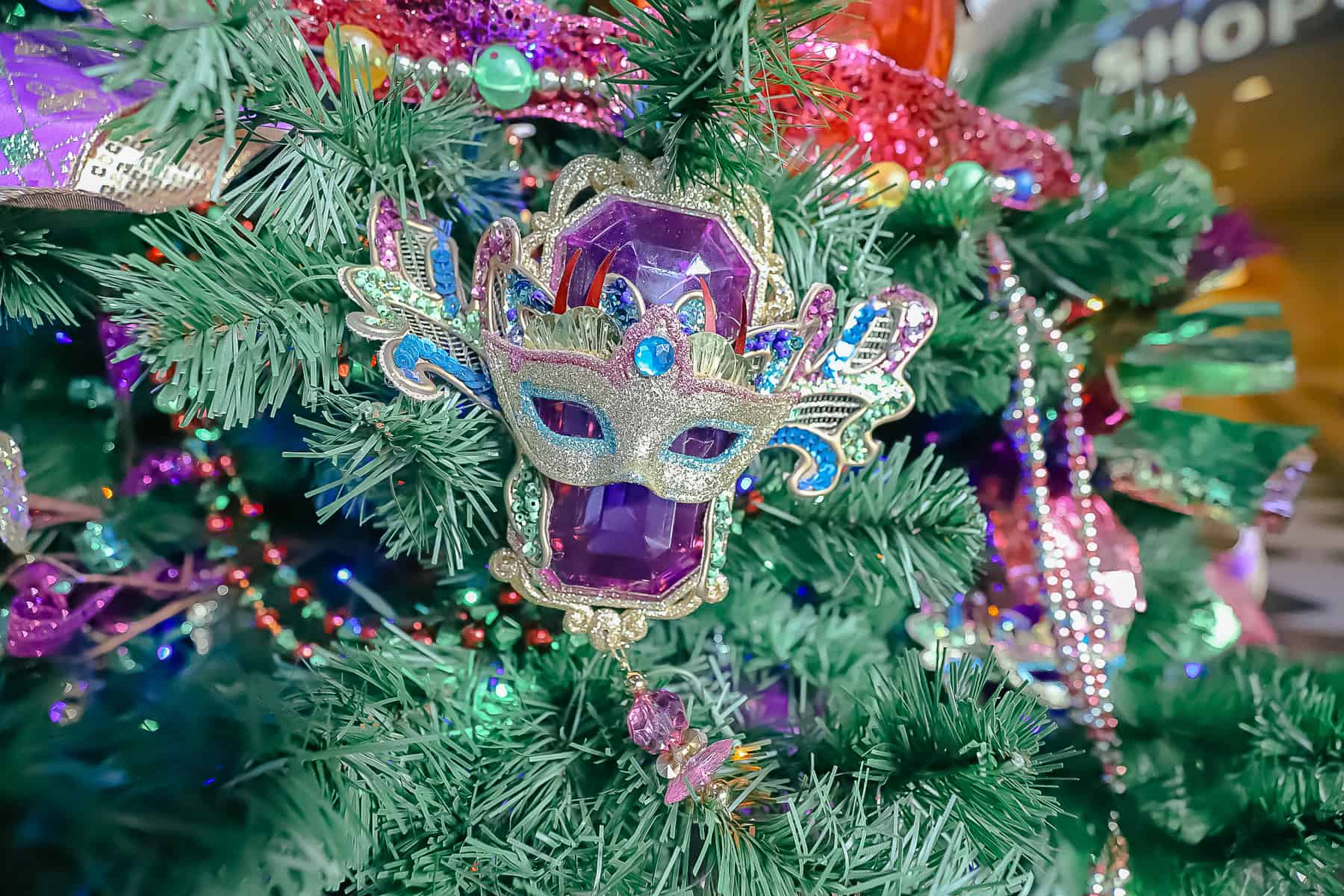masquerade ornaments over large purple jewels 
