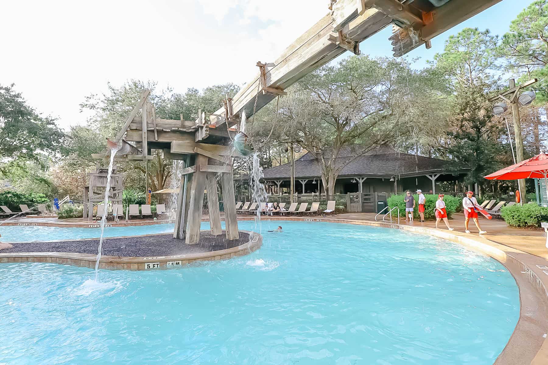 a water feature at Port Orleans Riverside Pool that drops buckets of water onto guests 