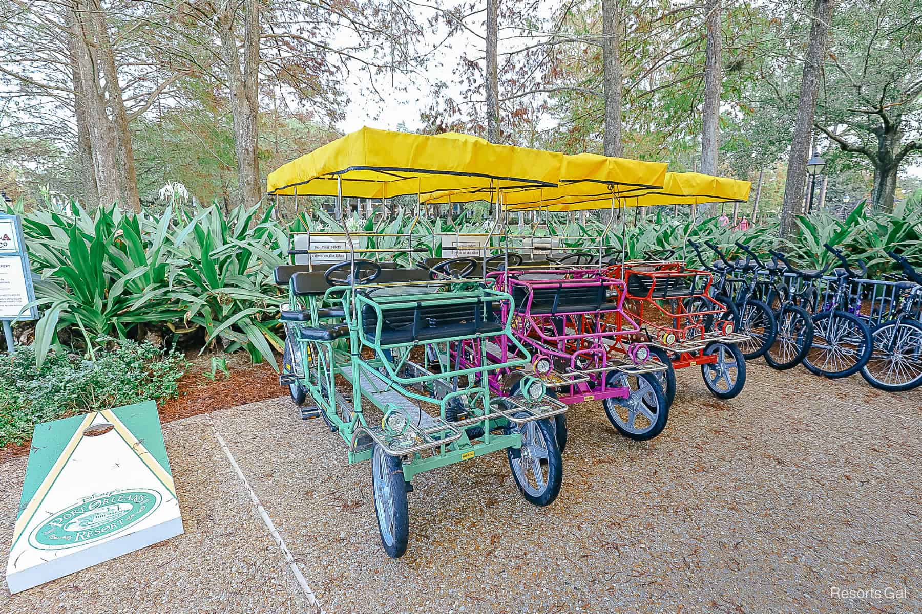 a cornhole game with the Port Orleans Resort logo next to the Surry Bikes 