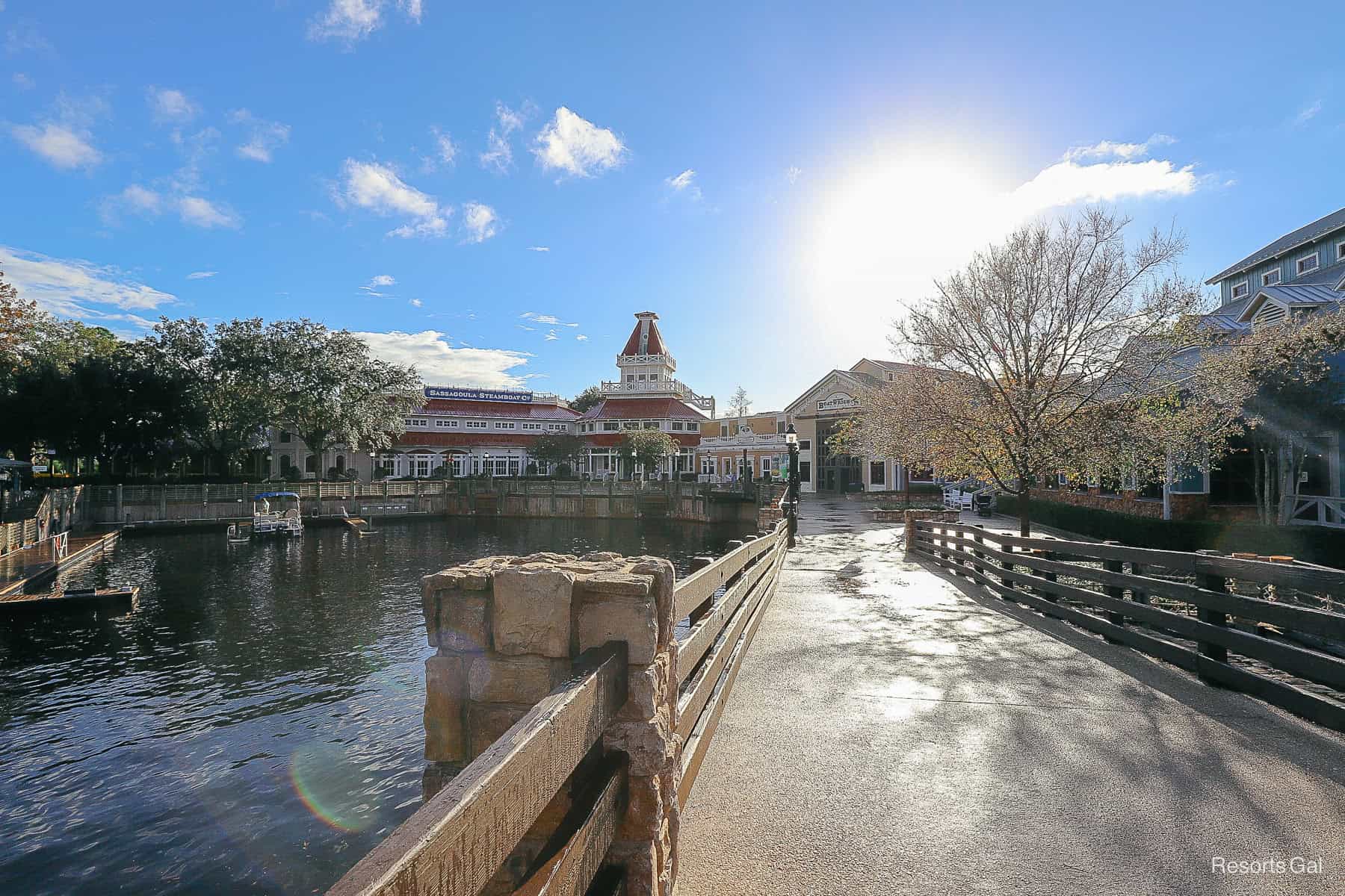 pretty picture of the resort with sun shining and trees in bloom 