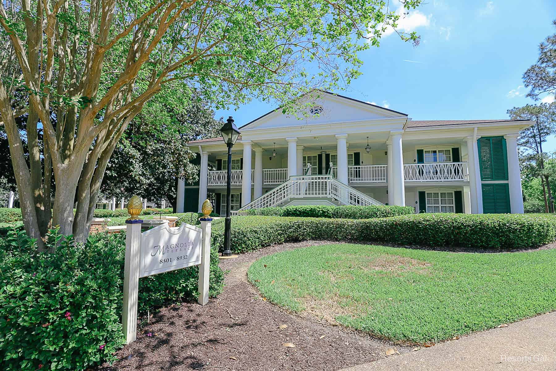 Magnolia Terrace have white railings with green shutters 