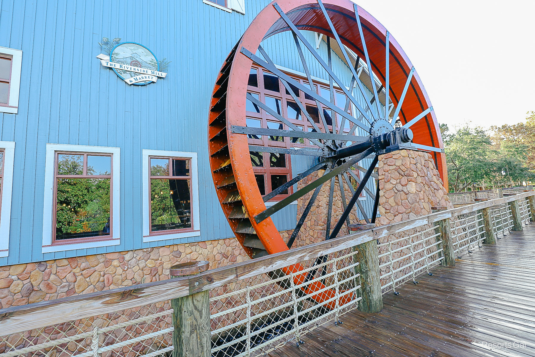 the large red water wheel that sits outside of Riverside Mill 