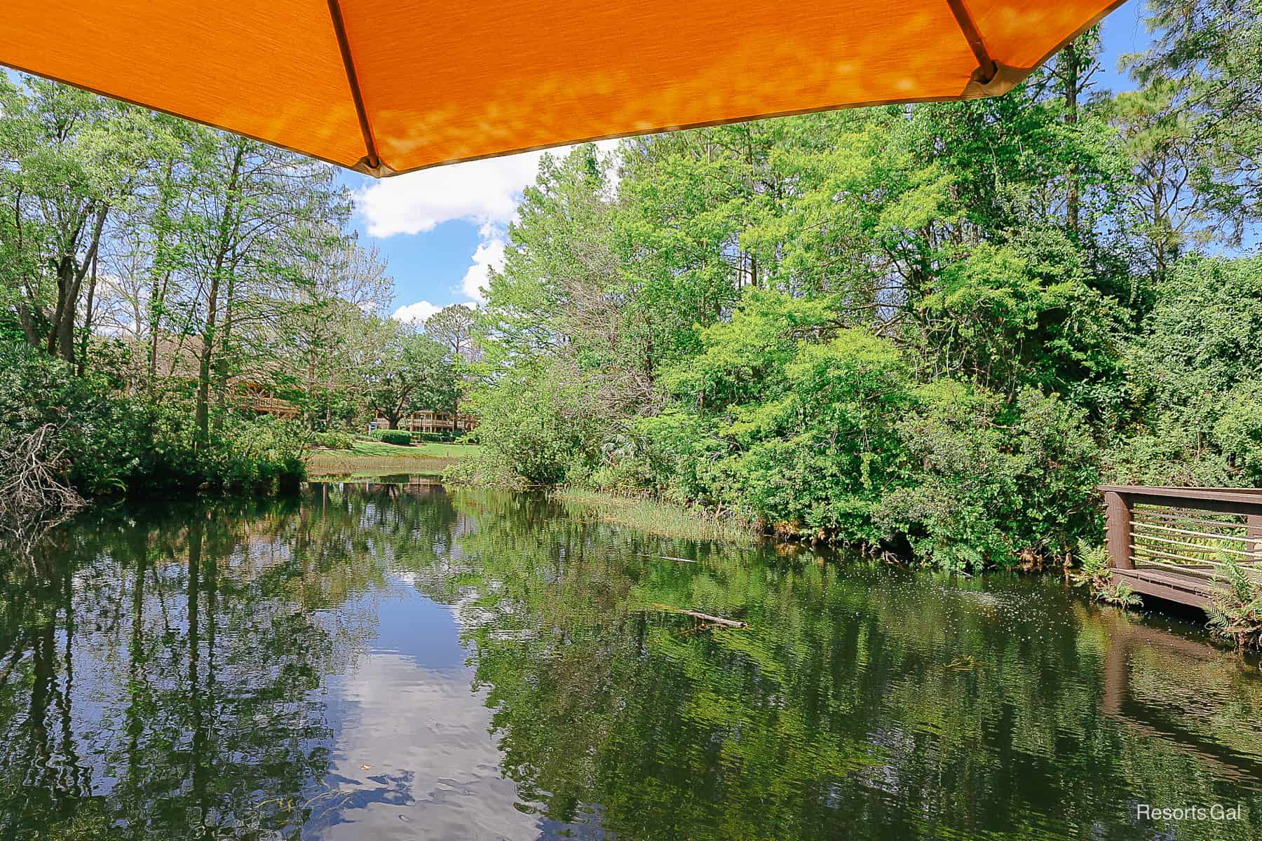 a view of the river at Port Orleans Riverside from under a yellow umbrella 