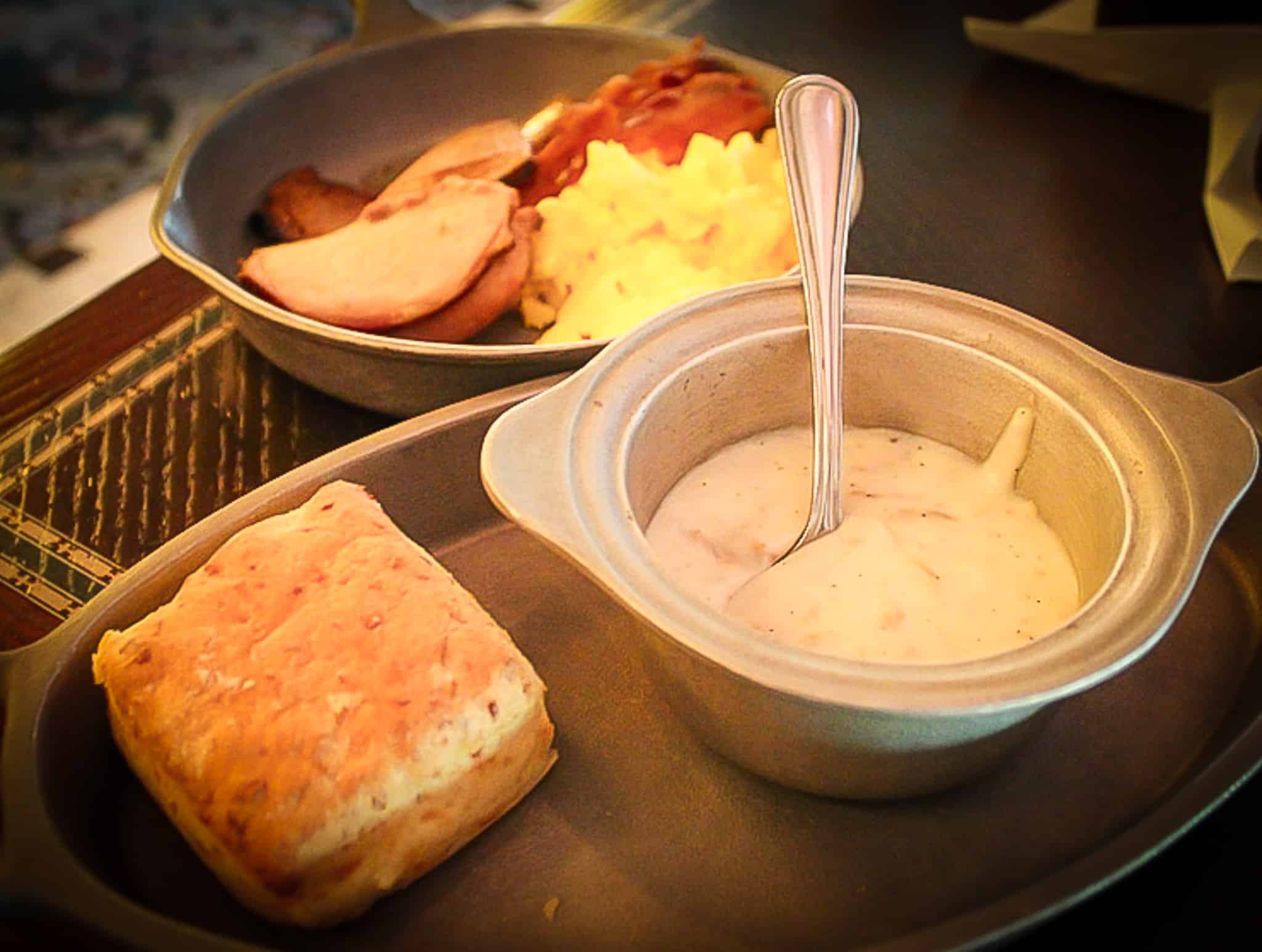 biscuits, gravy, and a breakfast skillet with various meats