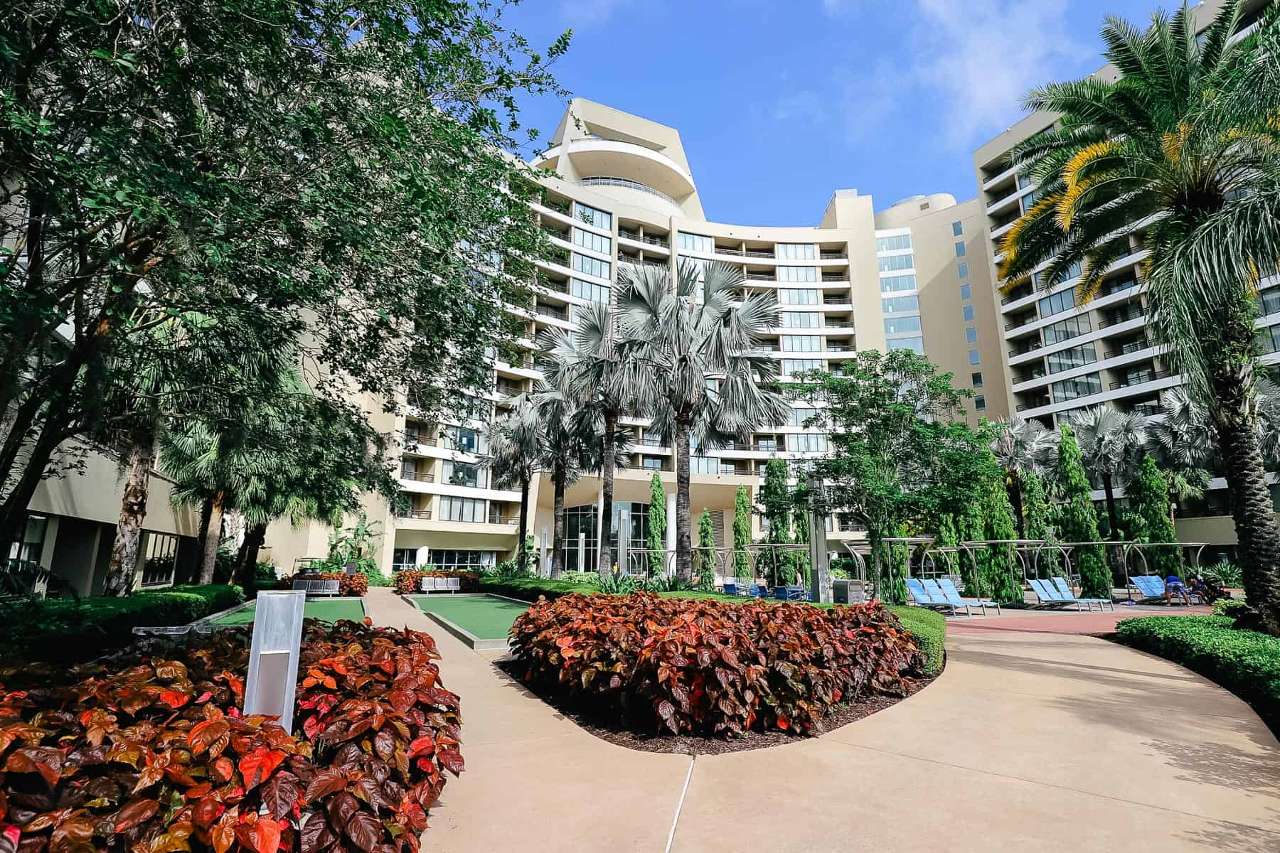 The back of Bay Lake Tower with palms and bamboo trees. 