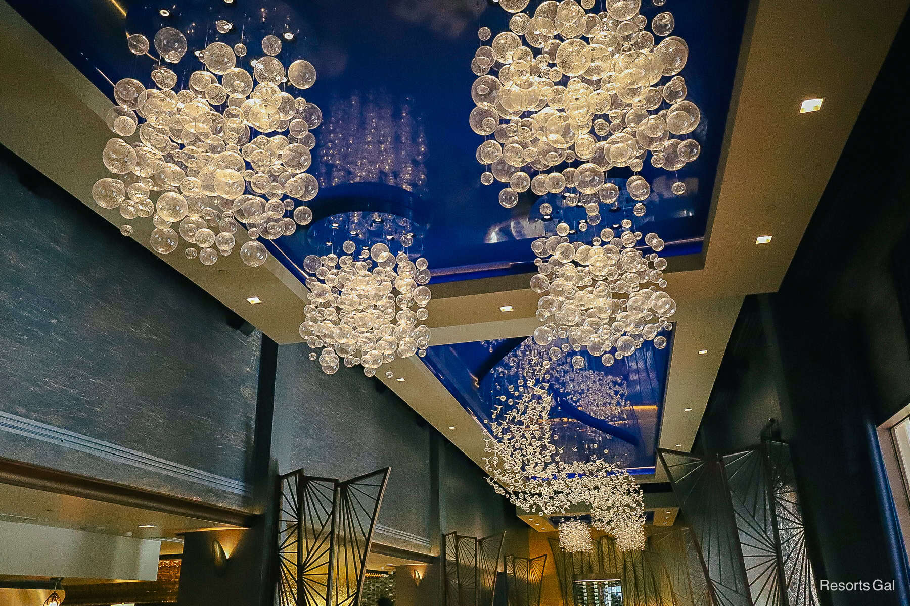 the interior of Flying Fish at Disney's BoardWalk with glass bubble light fixtures