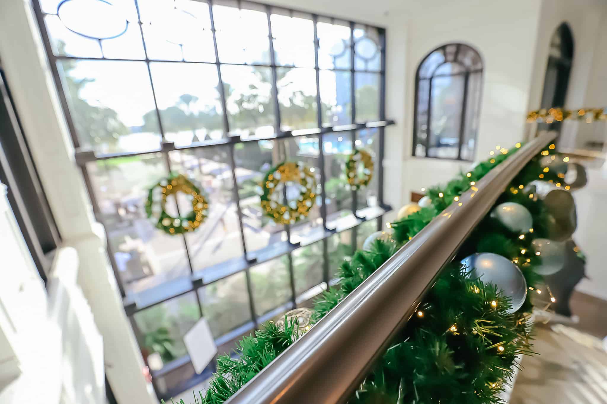 Garland wrapped around the staircase at Disney's Riviera Resort. 