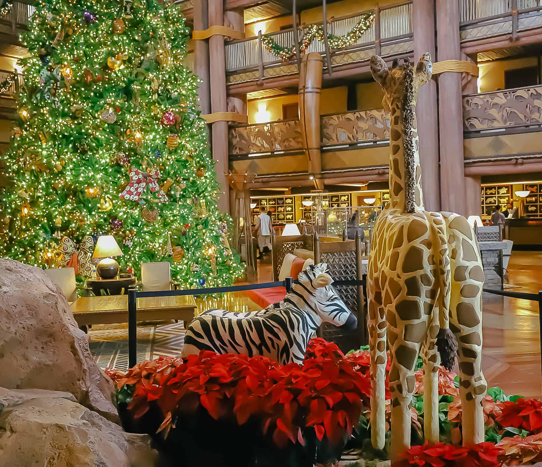 A decorative photo of the gingerbread display at Animal Kingdom Lodge facing the Christmas Tree. 