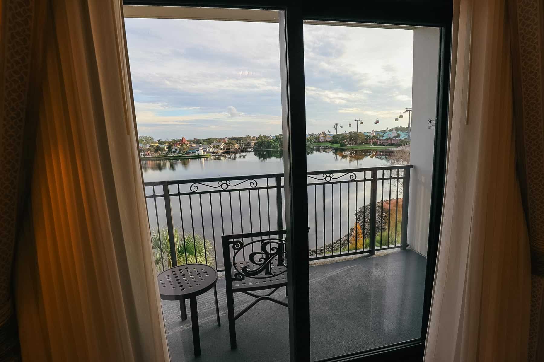 a view of sliding doors to a balcony that faces Barefoot Bay Lake at Disney's Riviera 