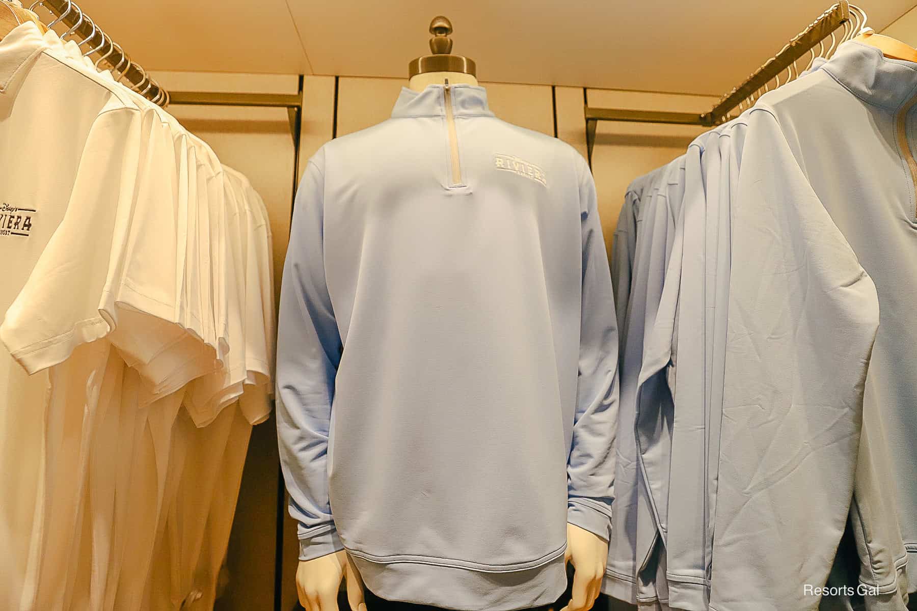a close up of the light blue partial zip-up pullover 