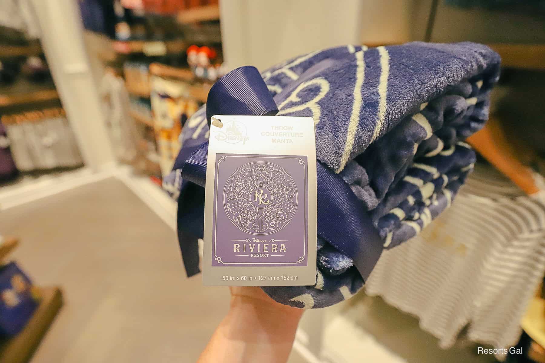 a tag shows the design of the Riviera plush throw 
