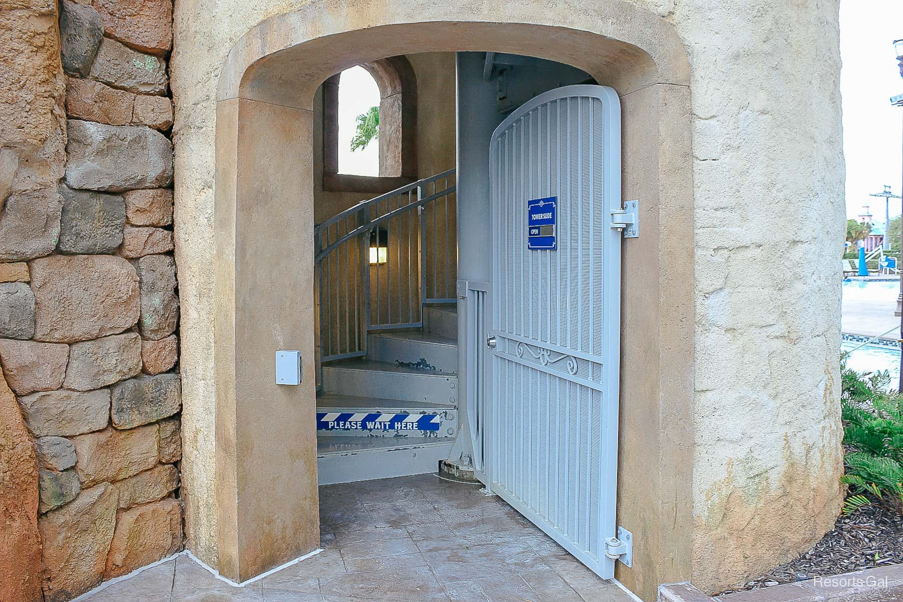 the door to the spiral staircase that leads up to the slide at the Riviera Pool 