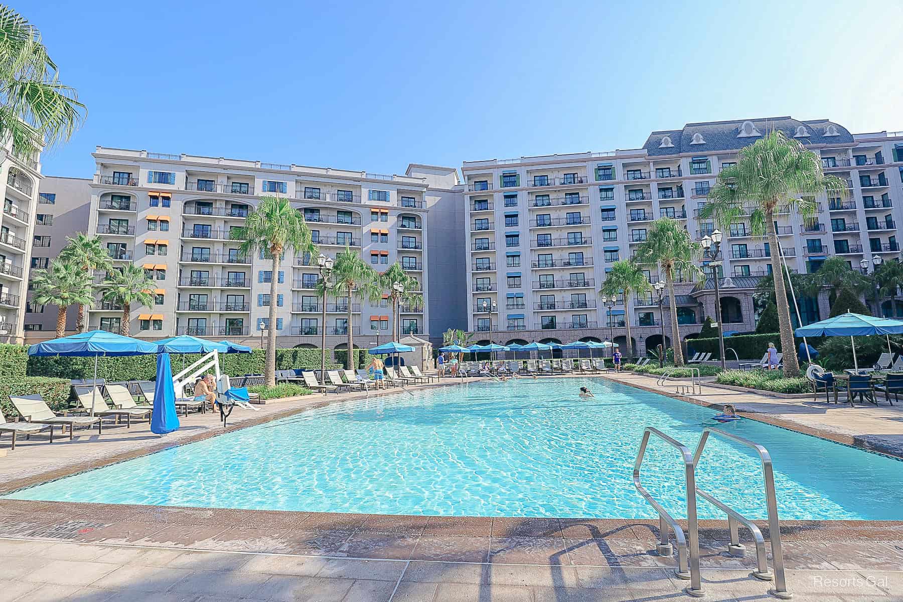a long rectangular pool sitting in front of the Riviera Resort
