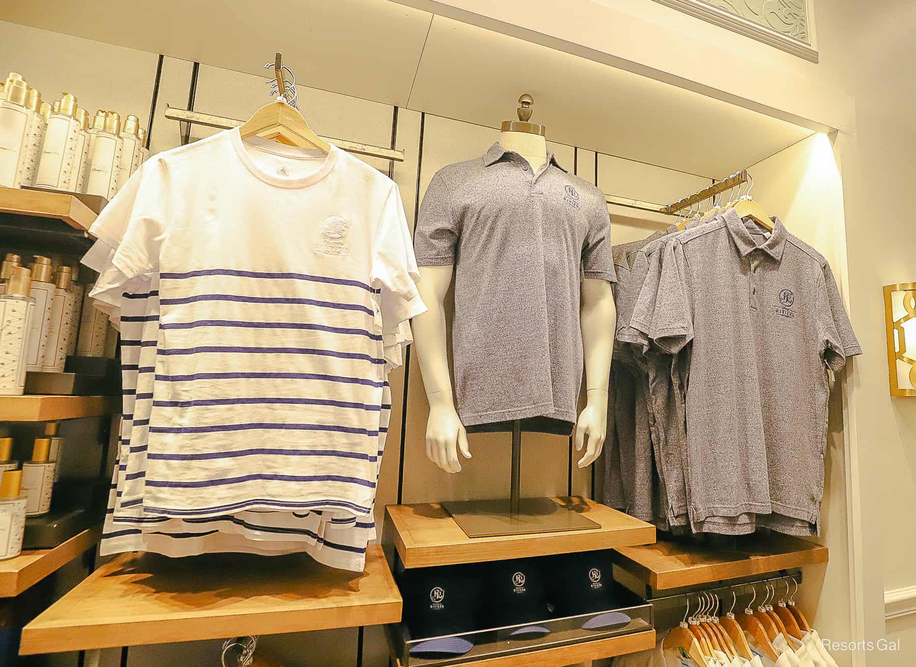 a white t-shirt with navy stripes and a men's navy polo shirt 