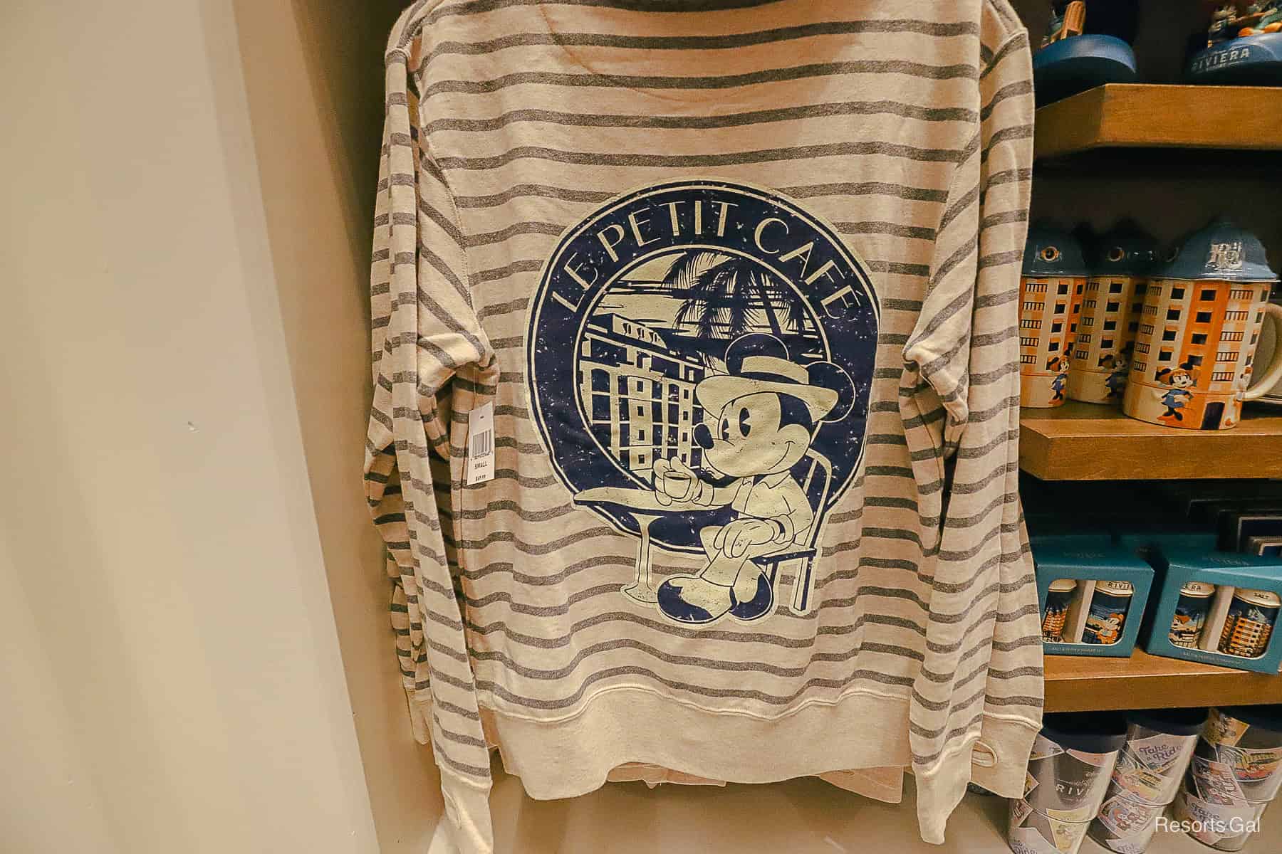 a pictures of Mickey at Le Petit Cafe on the back 