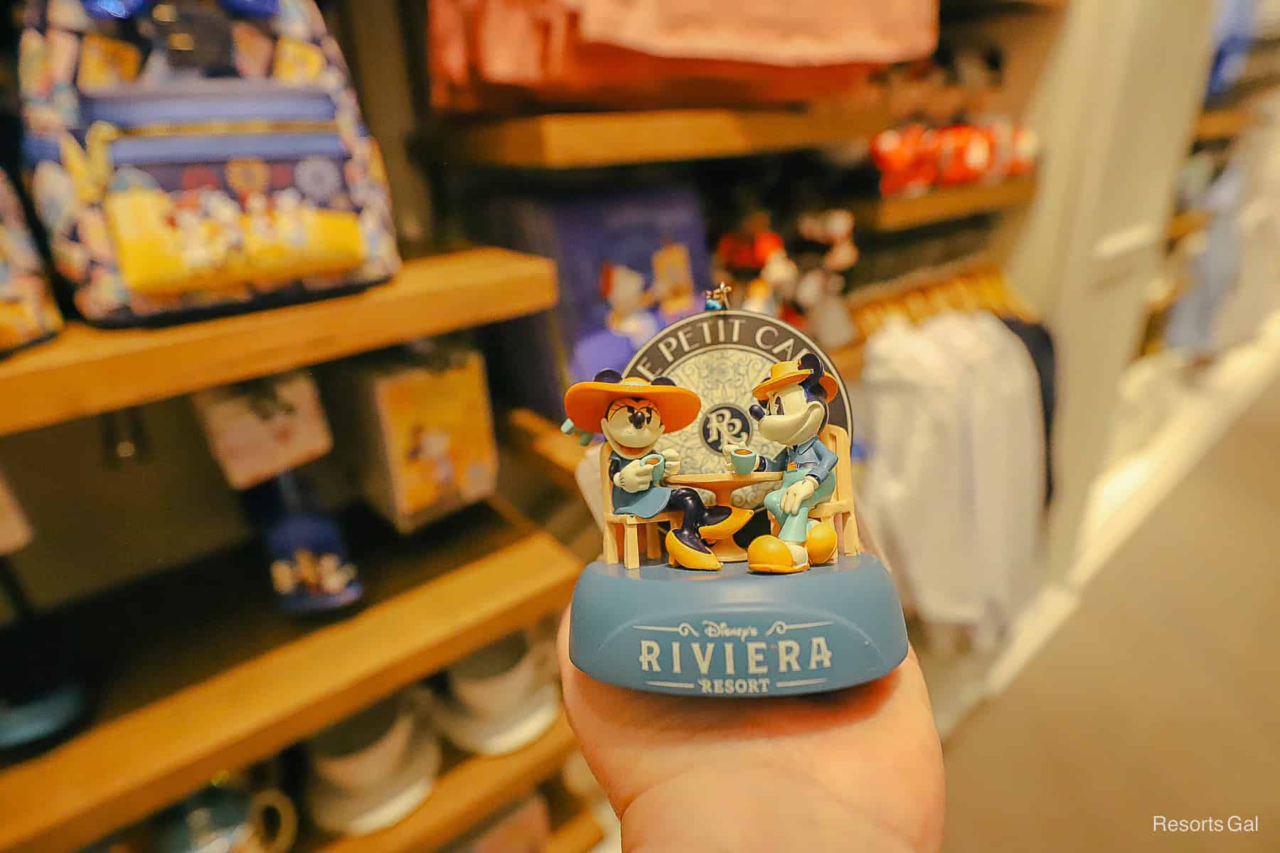 a Sketchbook ornament with Le Petit Cafe and Minnie and Mickey enjoying a coffee 