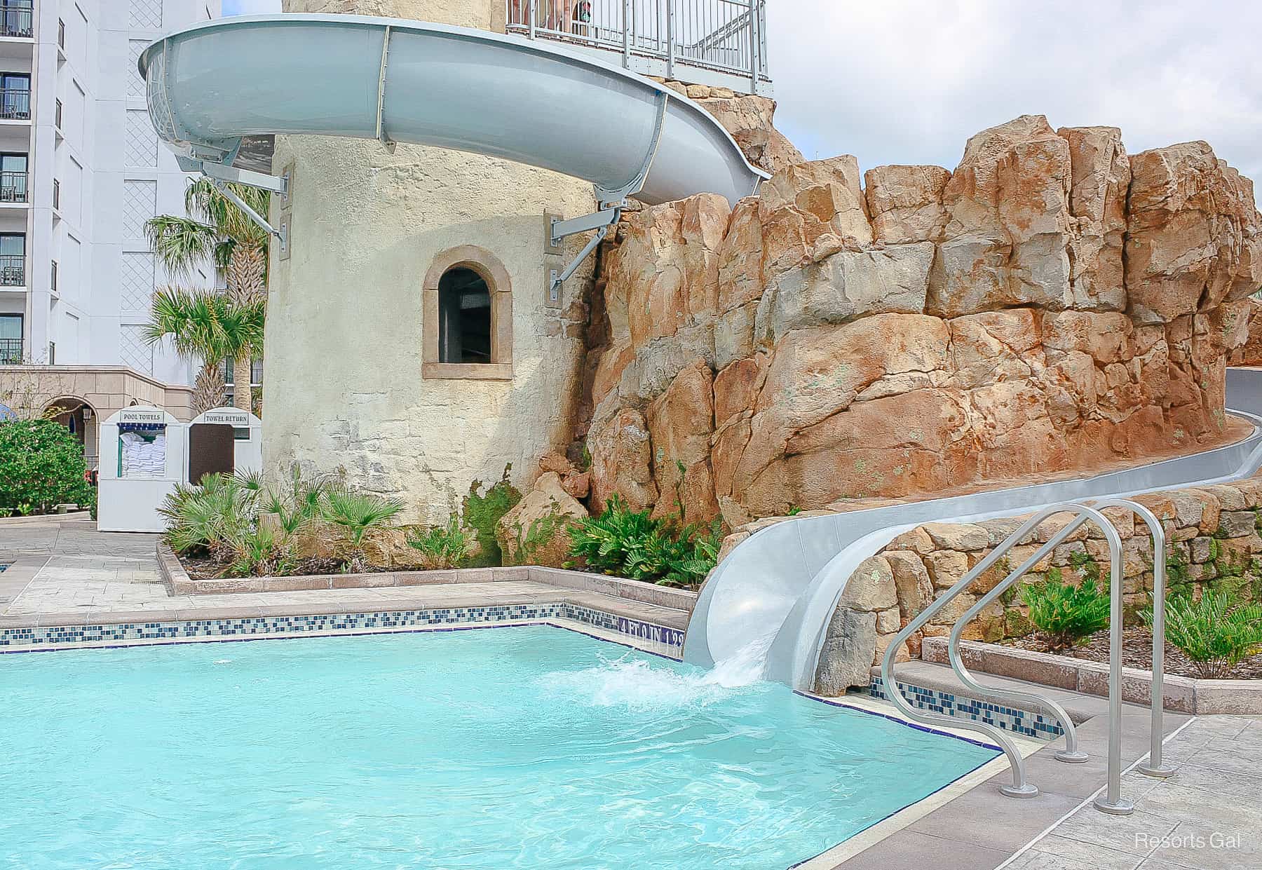 the waterslide exits into the pool area 