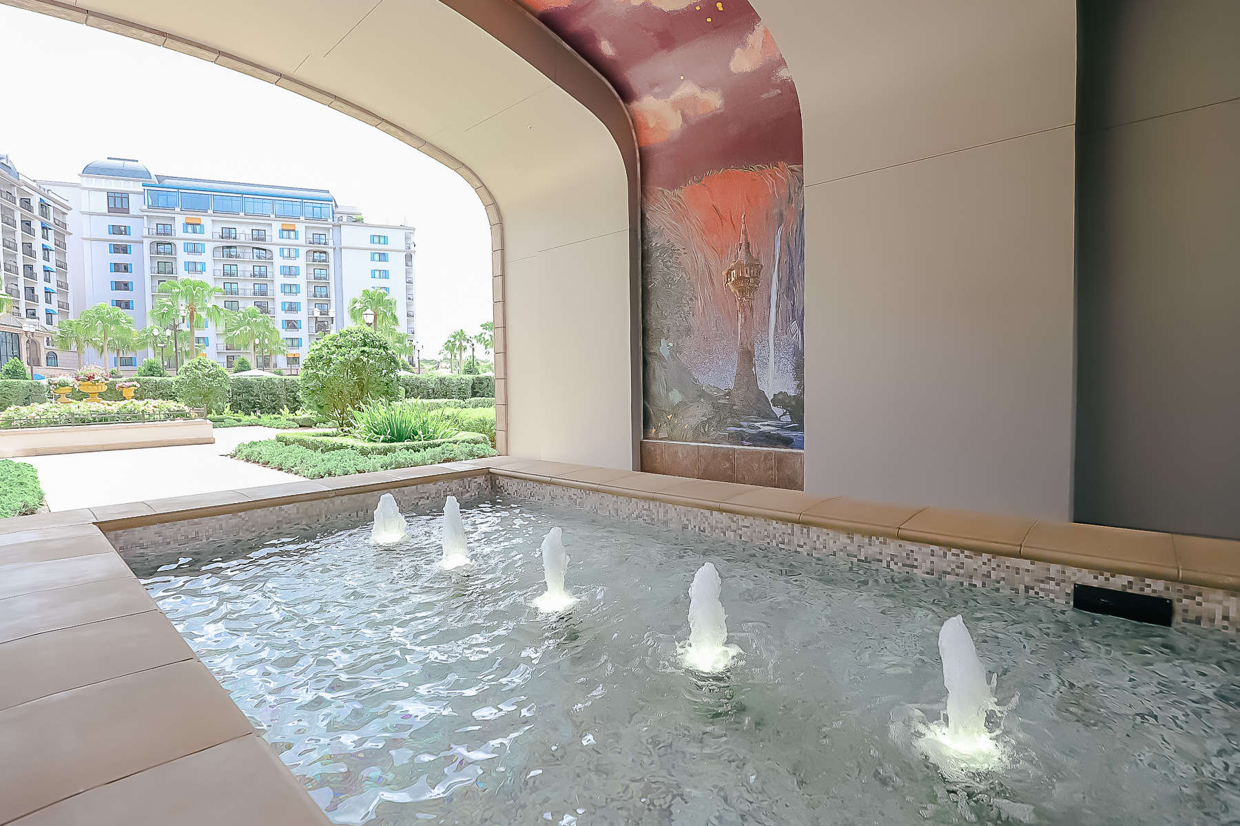 fountains at Disney's Riviera with the Tangled Mural in the background 