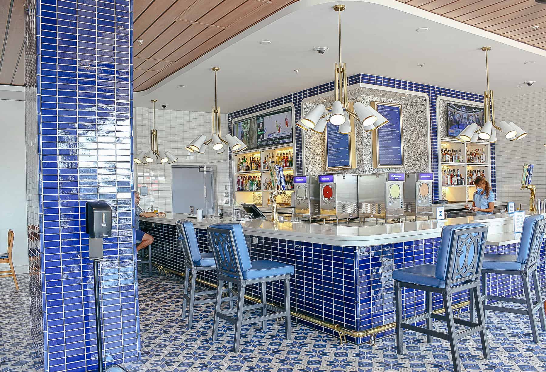 the Bar Riva Lounge with lots of blue tile work in various patterns with white accents 