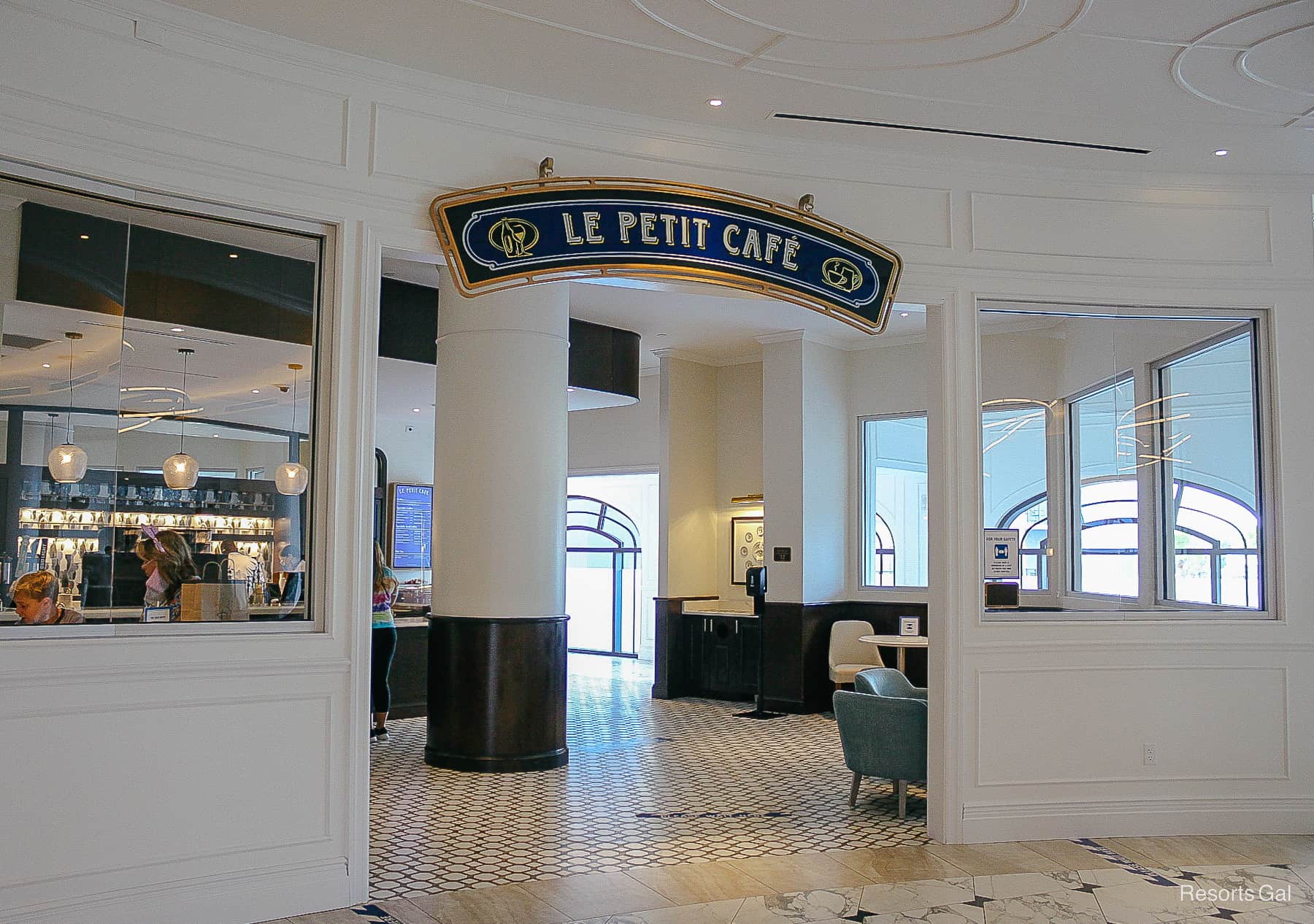 the entrance to Le Petit Cafe at Disney's Riviera 
