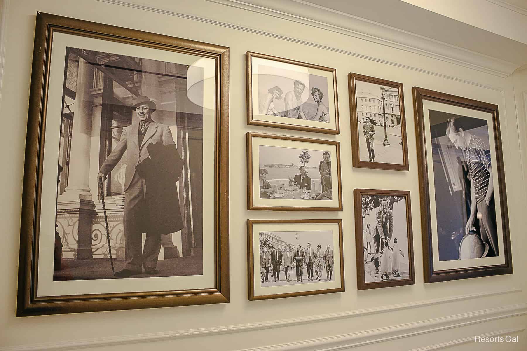 a wall with black and white photos of Walt Disney and his family 