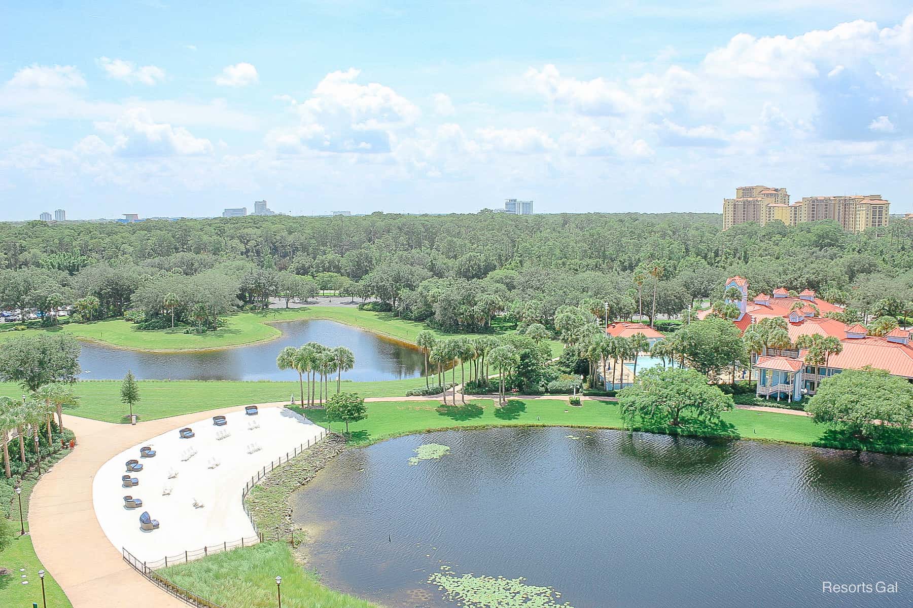 a view of the beach and lake from a room in Disney's Riviera Resort 