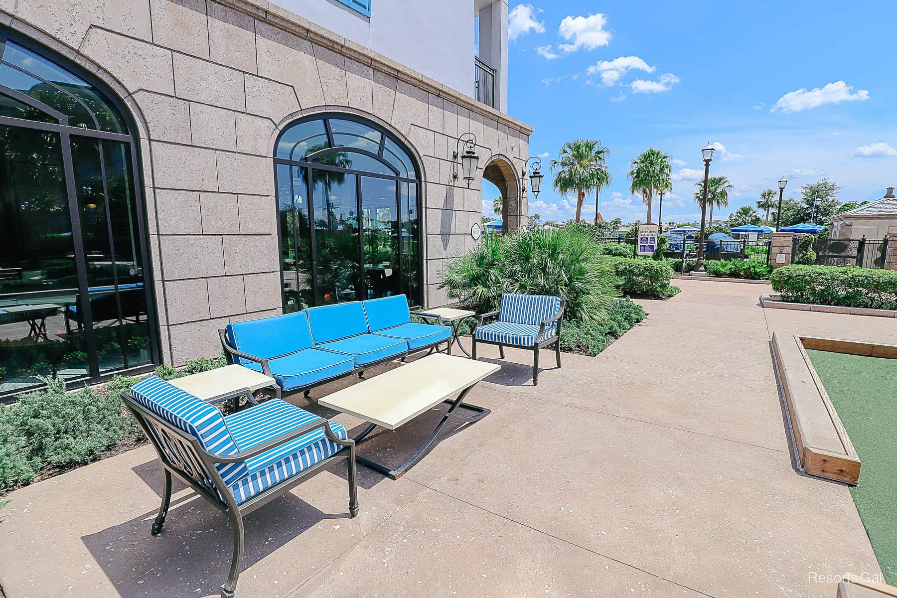 an outdoor seating arrangement with blue and white striped fabric at Disney's Riviera 