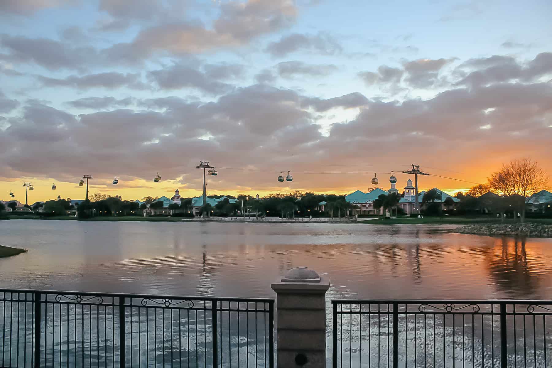 a view of the lake from Disney's Riviera at sunset with the Skyliner 