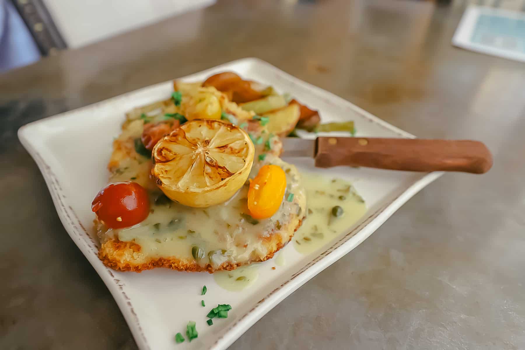 A plate with Chicken Paillard from Chef Art Smith's Homecomin'. 