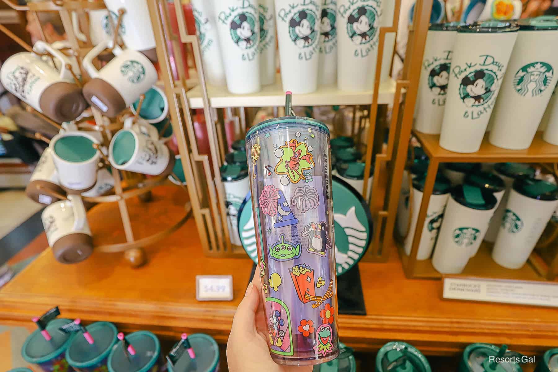 a side with park icons on the travel tumbler 