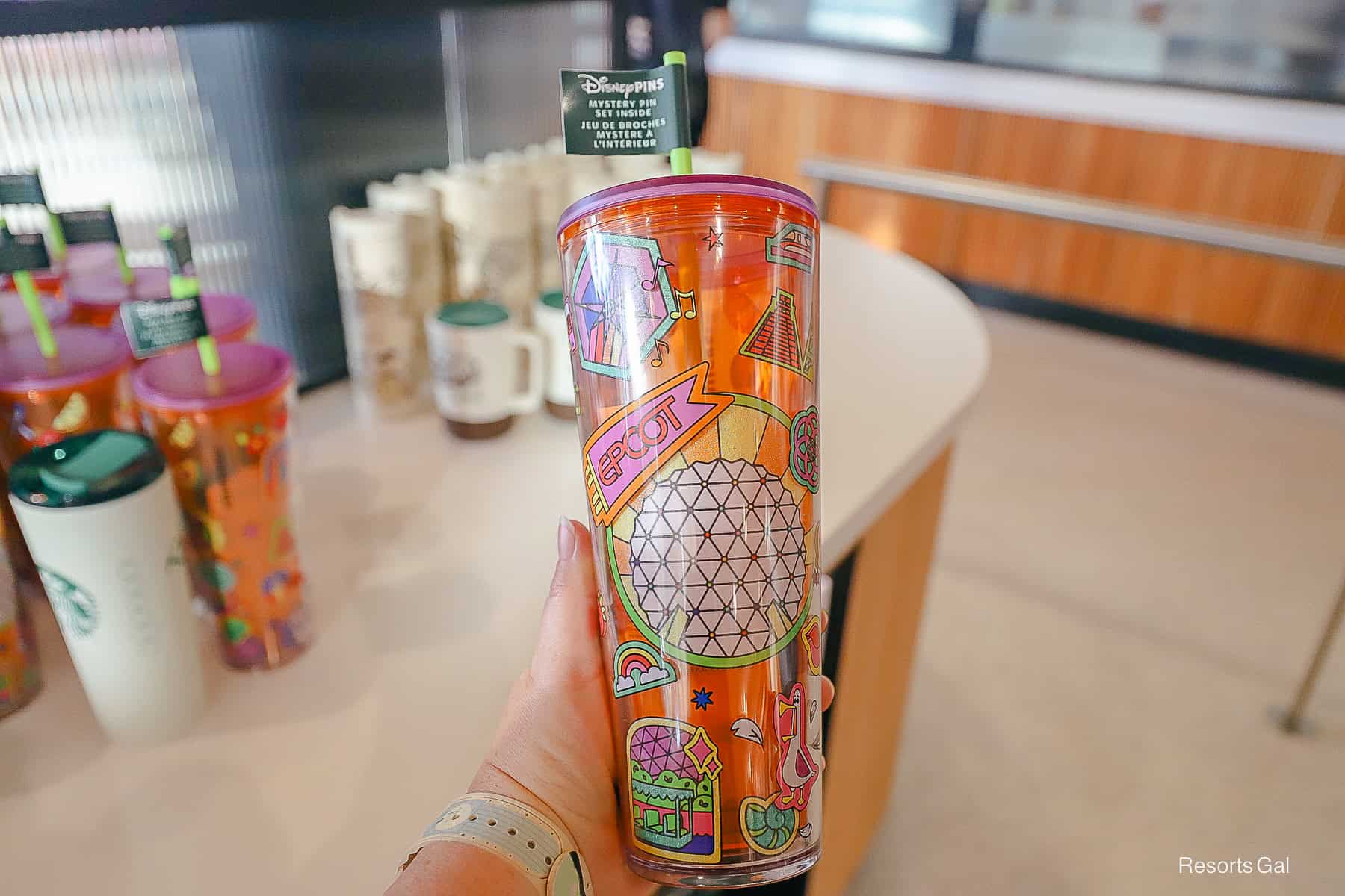 the Epcot Starbucks Travel Tumbler that comes with a mystery pin set 