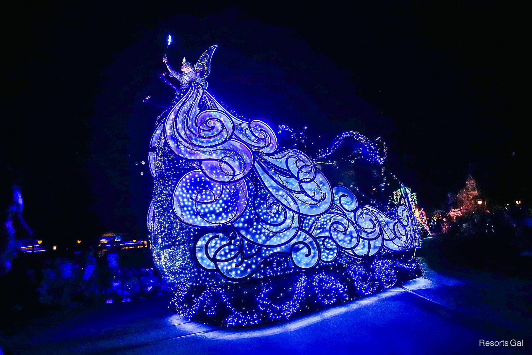 the Blue Fairy Float as seen from Main Street U.S.A. during the nighttime parade at Magic Kingdom 