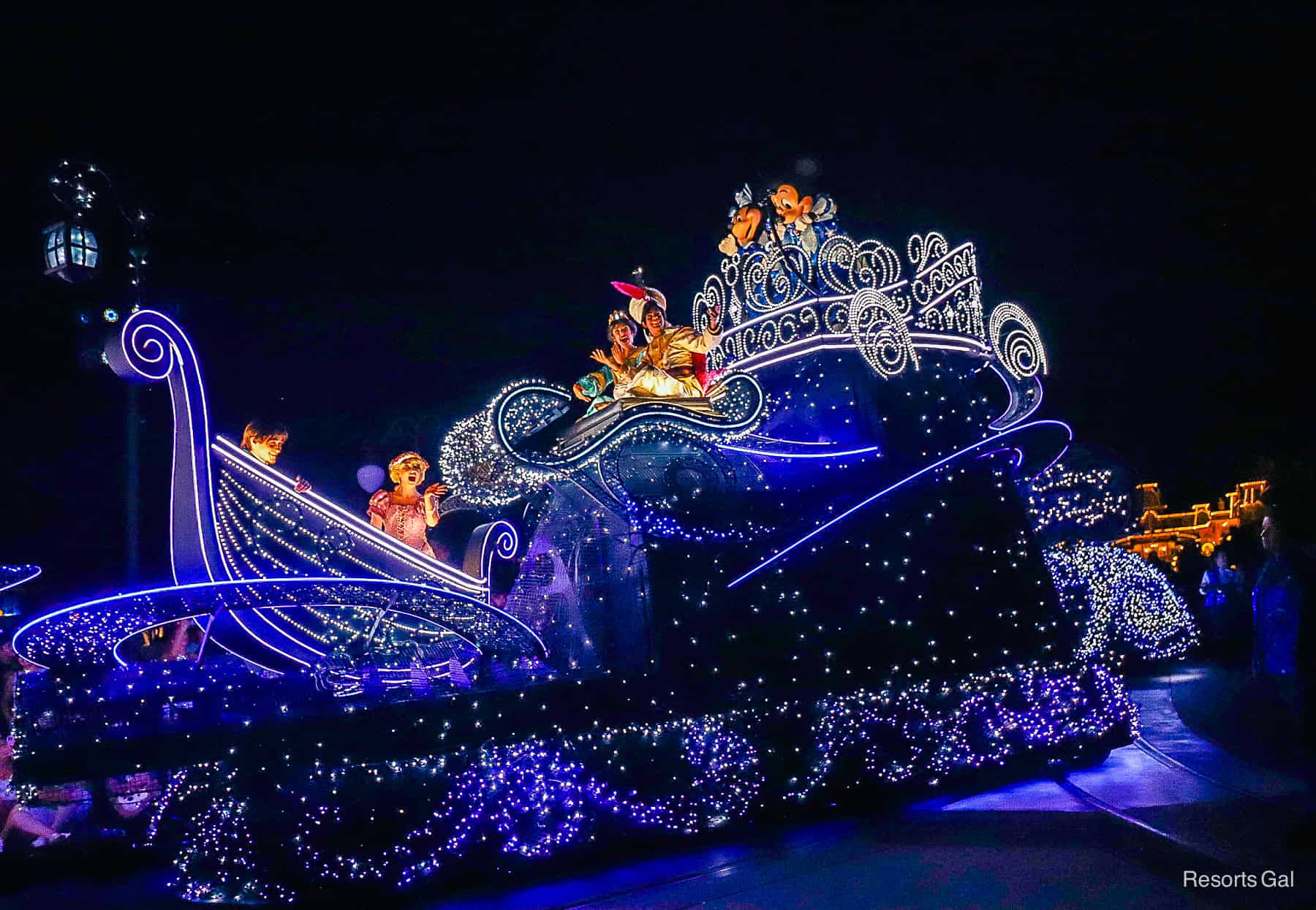 Flynn Rider, Rapunzel, Princess Jasmine, Prince Ali, Mickey Mouse, and Minnie Mouse ride on the finale float in Disney Starlight Dream the Night Away 