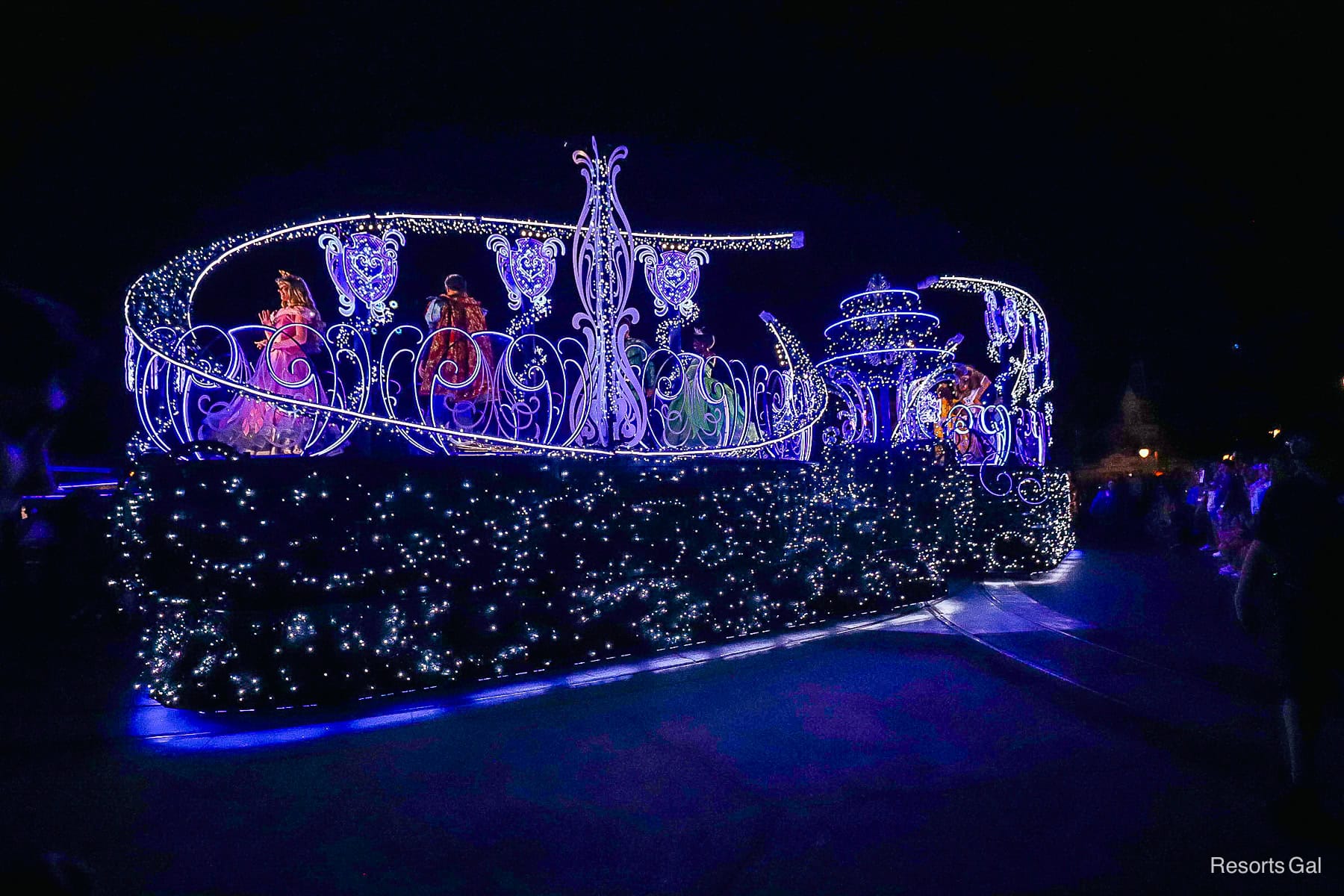 five sets of royal couples ride on the Disney Starlight: Dream the Night Away princess float 