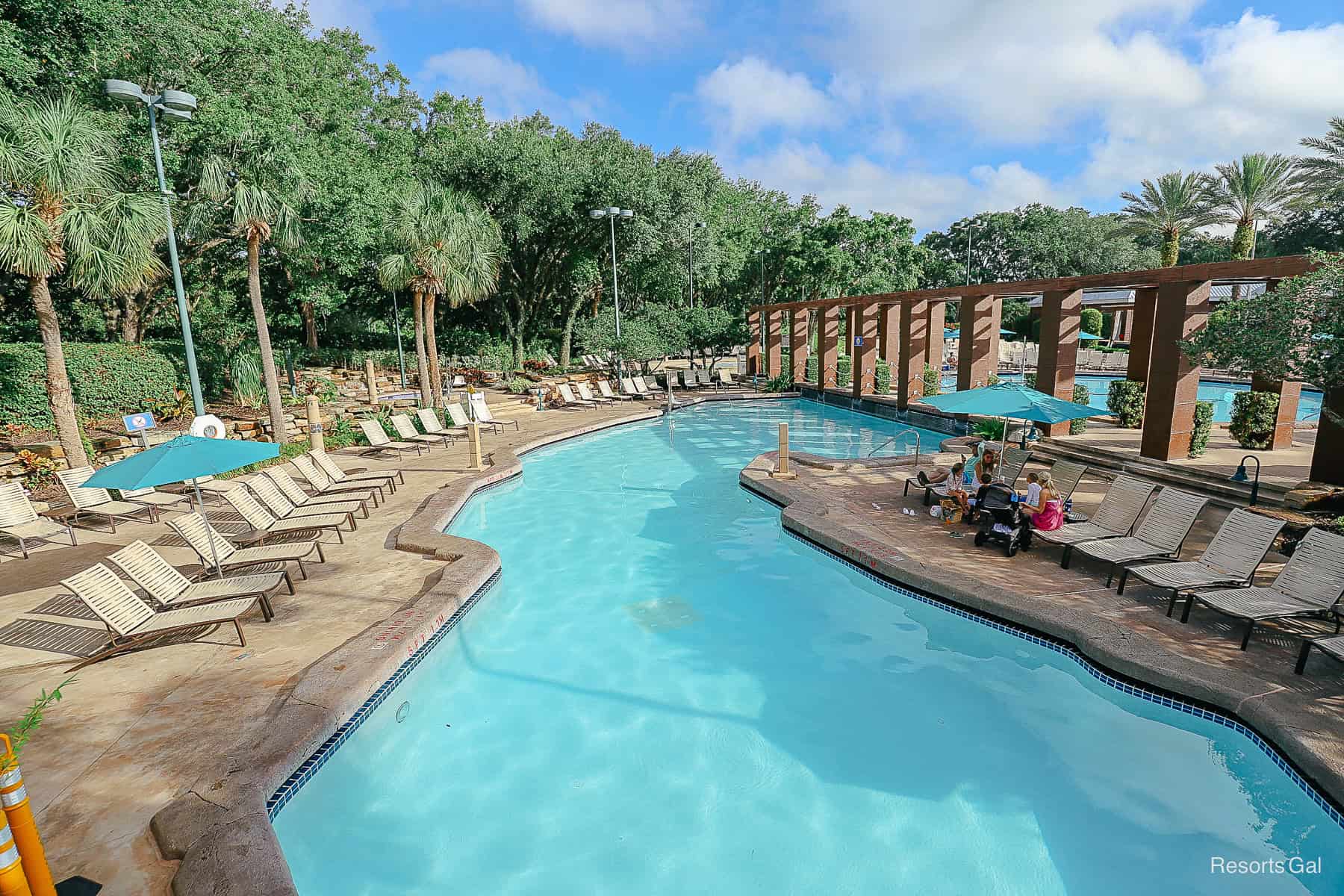 an extended area of the pool by the Dolphin with large brown columns 