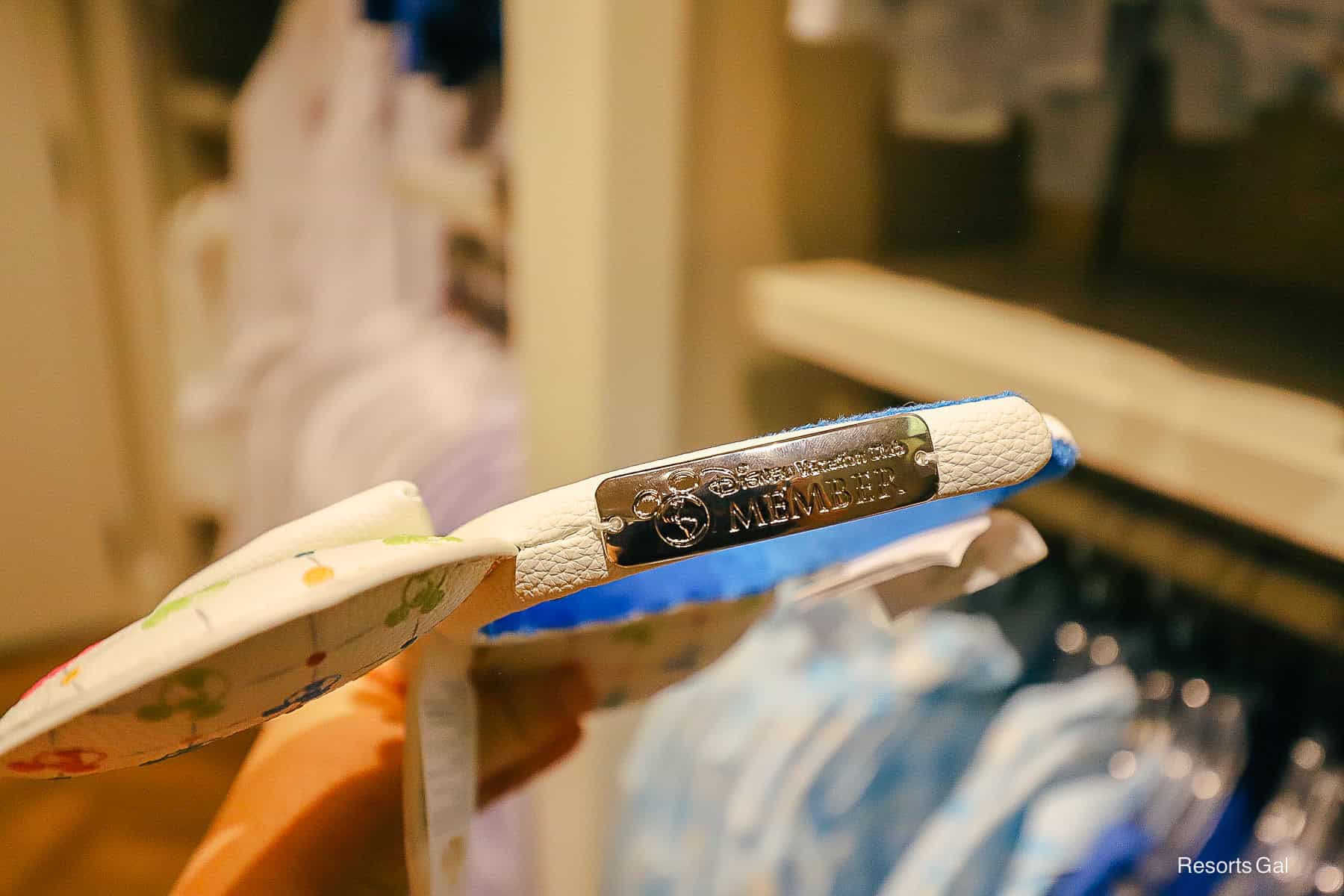 the Disney Vacation Club logo plate on the side of the Minnie Ears