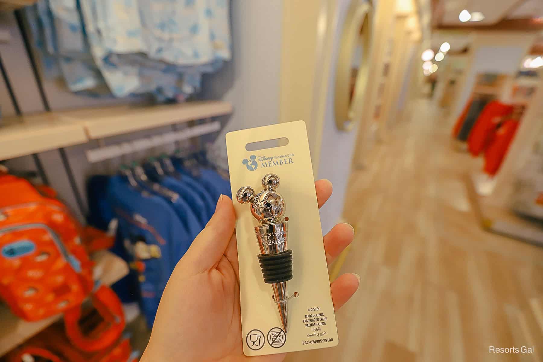 a bottle topper with a silver mickey mouse