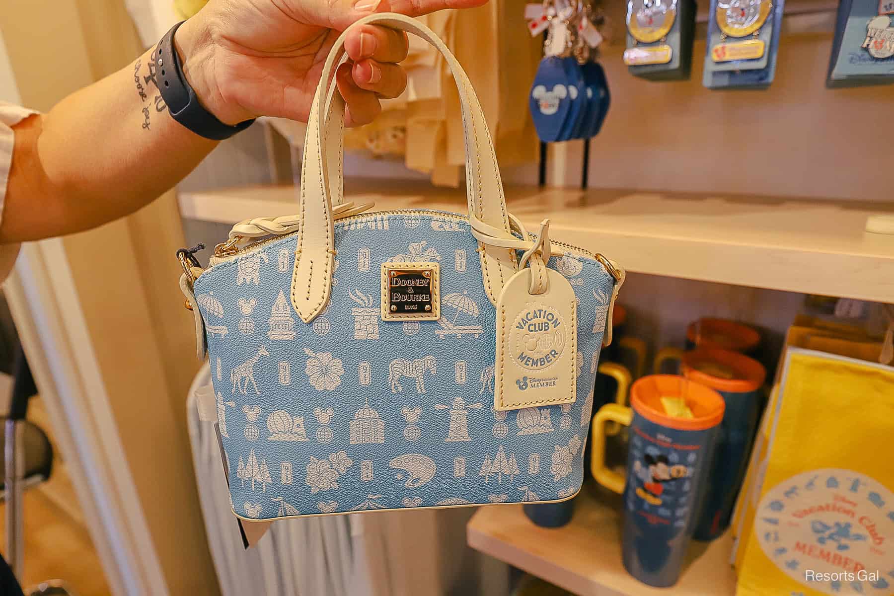the Dooney and Bourke crossbody with a Disney Vacation Club member tag