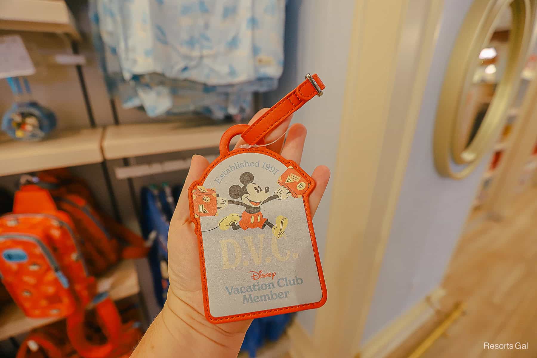 DVC member luggage tag with Mickey Mouse in light blue with orange trim