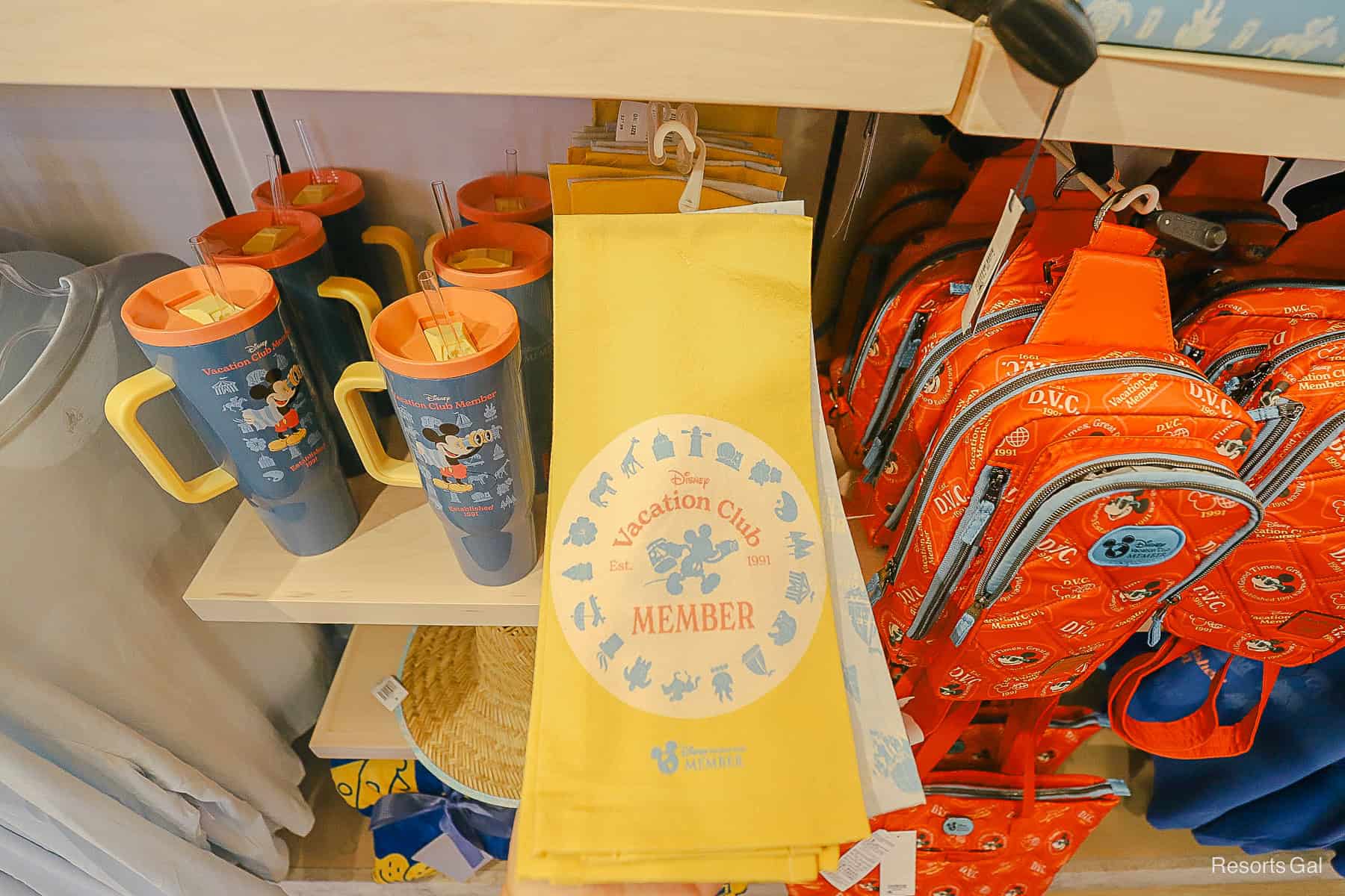 a yellow kitchen towel with the DVC logo