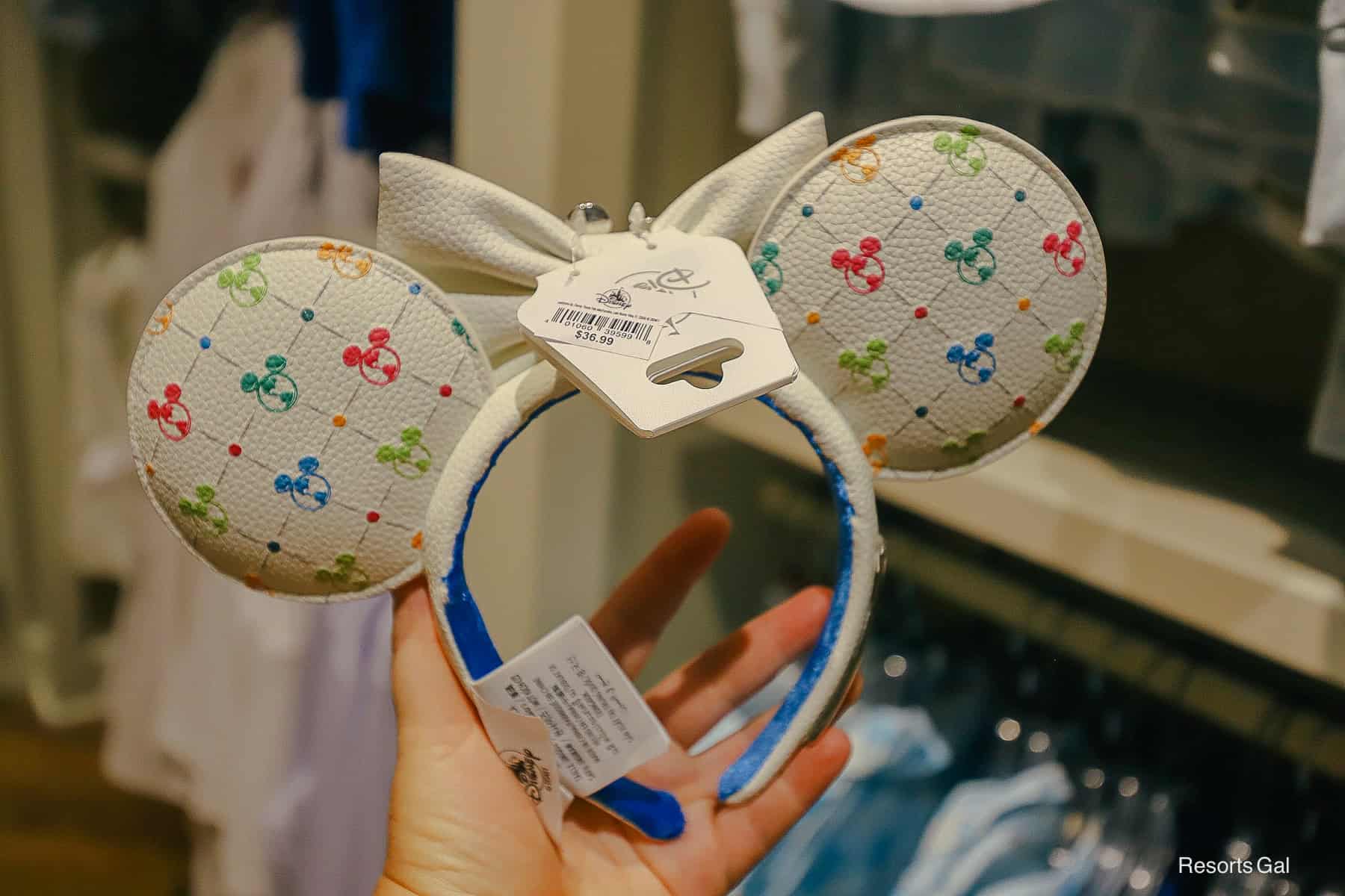 a hand holding a pair of DVC Minnie Ears